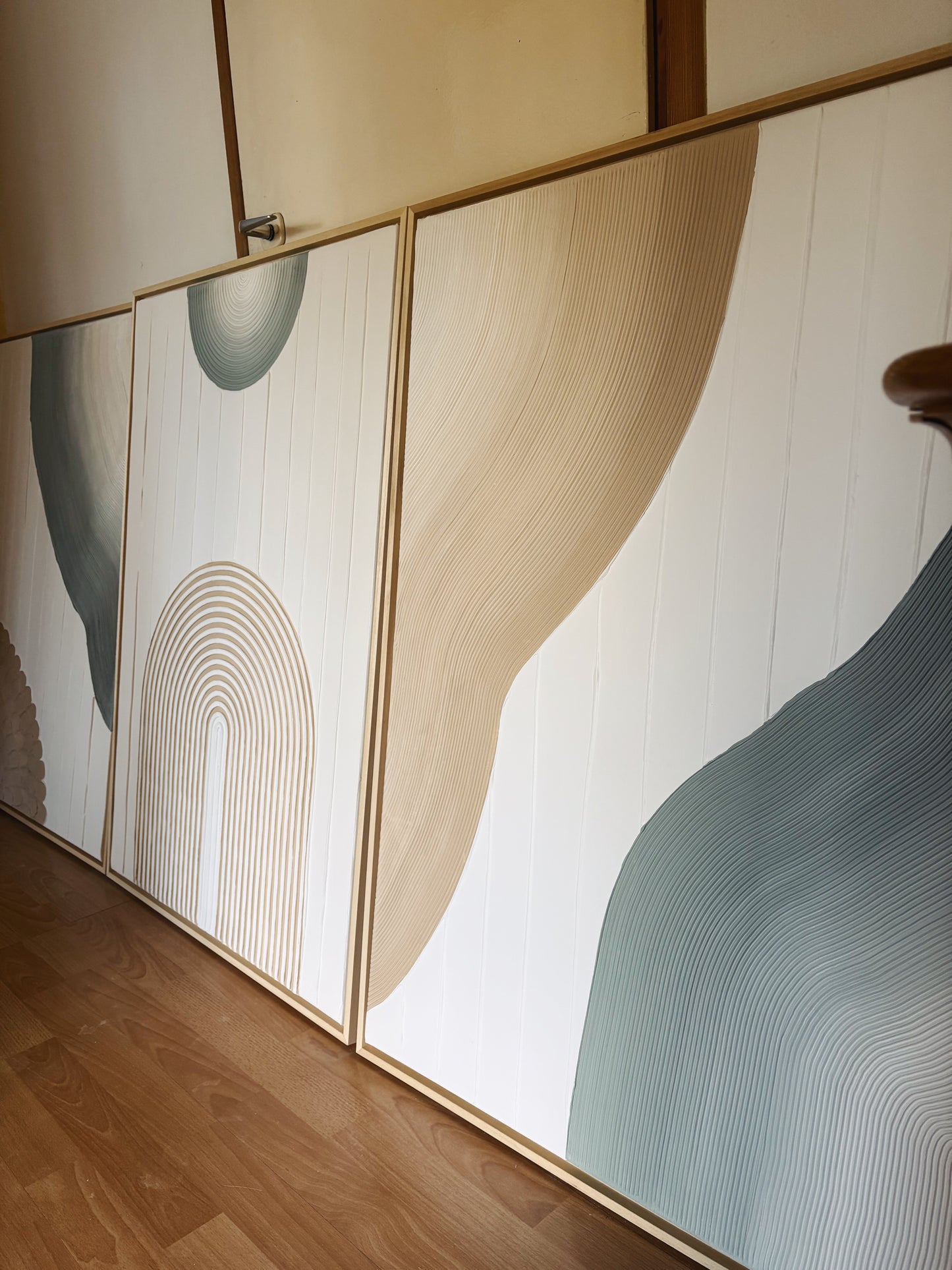 Abstract wall art with wavy lines on a white background
