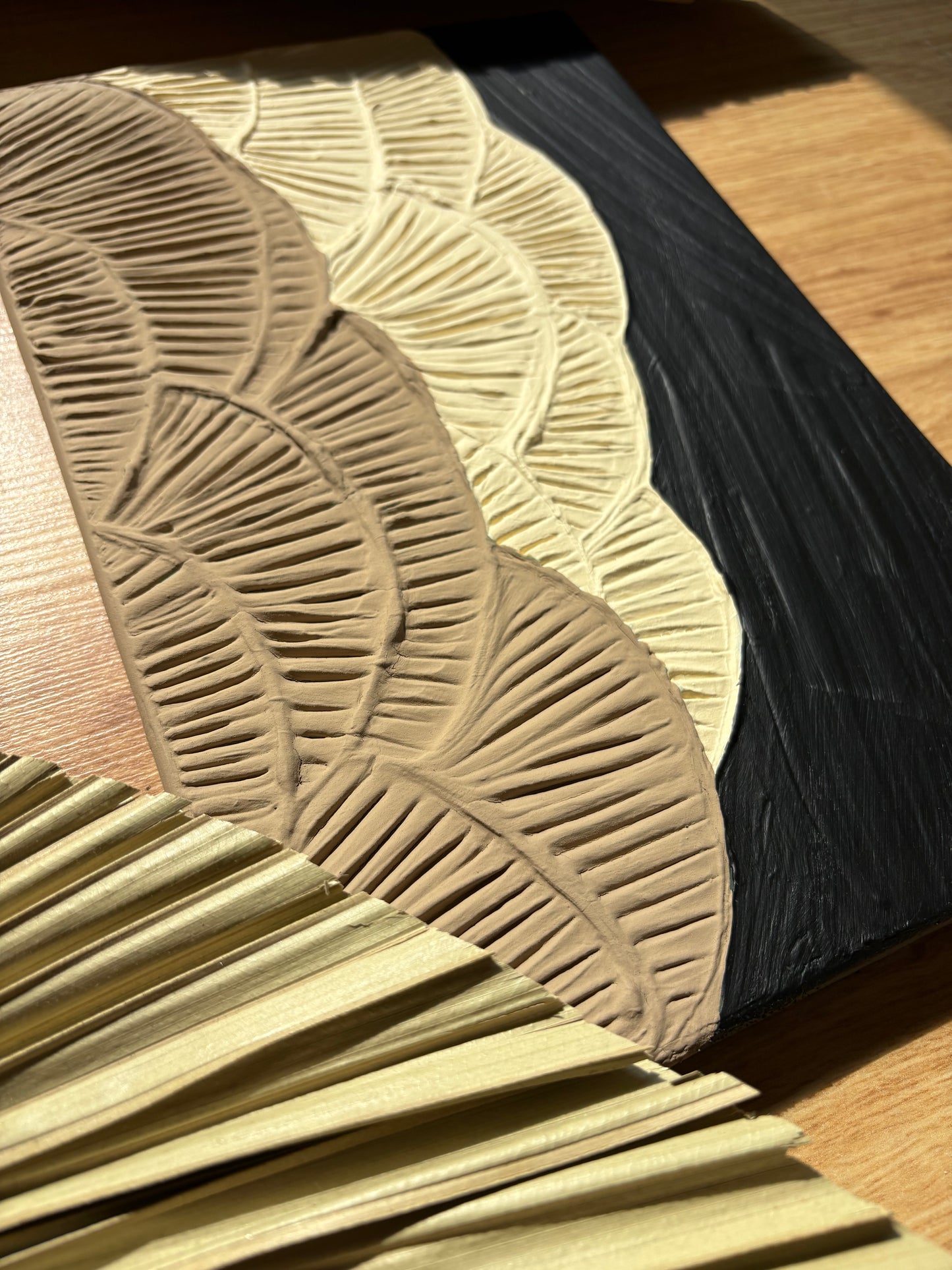 ANTHEIA artwork close-up showing detailed raised botanical texture