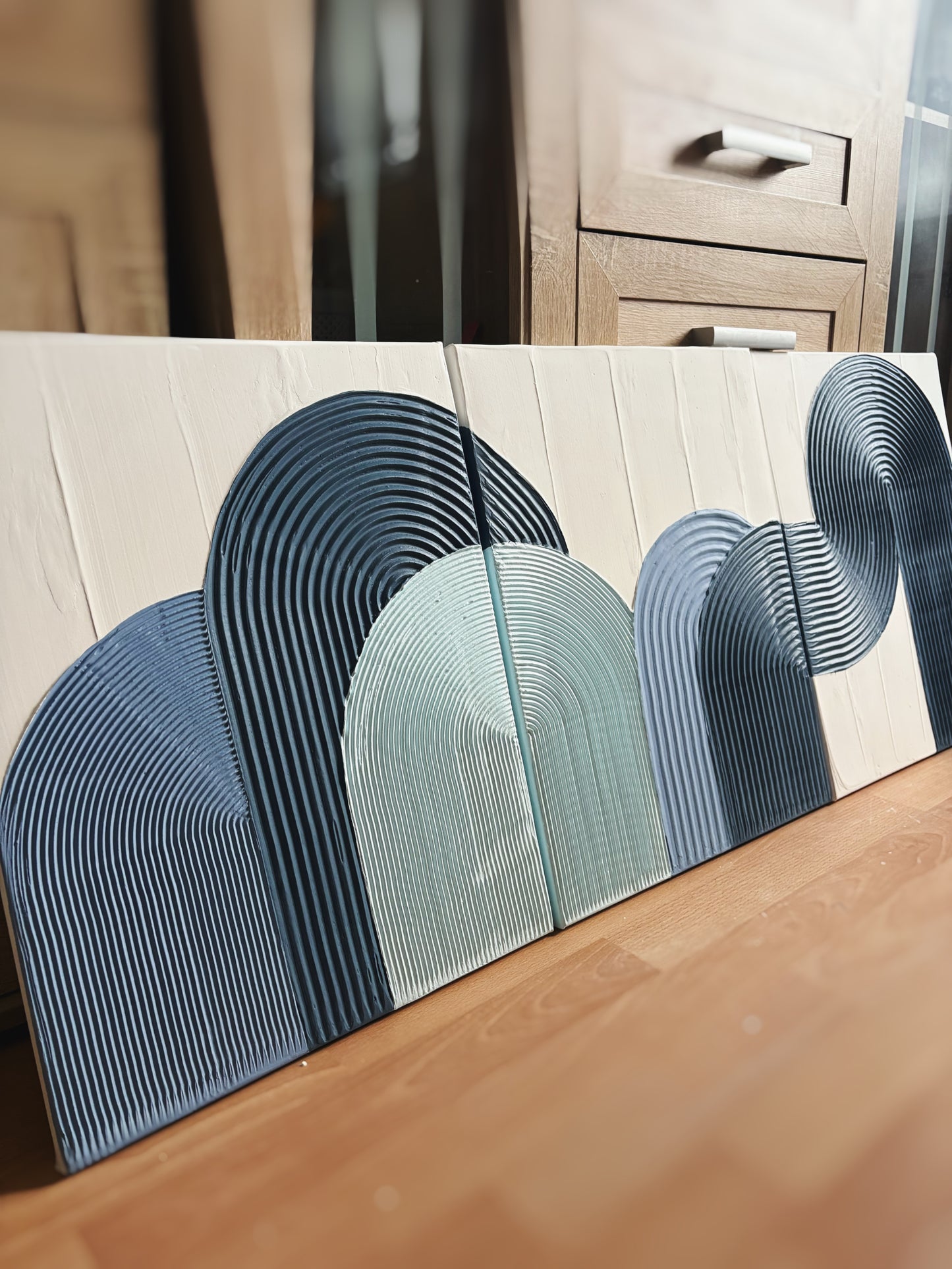 Blue textured wall art set
Coastal-inspired abstract paintings
Handcrafted 3D diptych artwork
Modern arched wall decor
Set of 3 minimalist blue art pieces
Beach house wall decor
Framed blue textured canvas set
Large coastal abstract artwork
Handmade ocean-inspired wall decor
Serene modern wall art in shades of blue