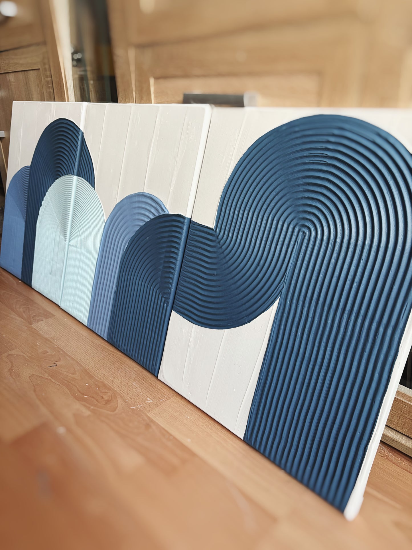 Blue textured wall art set
Coastal-inspired abstract paintings
Handcrafted 3D diptych artwork
Modern arched wall decor
Set of 3 minimalist blue art pieces
Beach house wall decor
Framed blue textured canvas set
Large coastal abstract artwork
Handmade ocean-inspired wall decor
Serene modern wall art in shades of blue