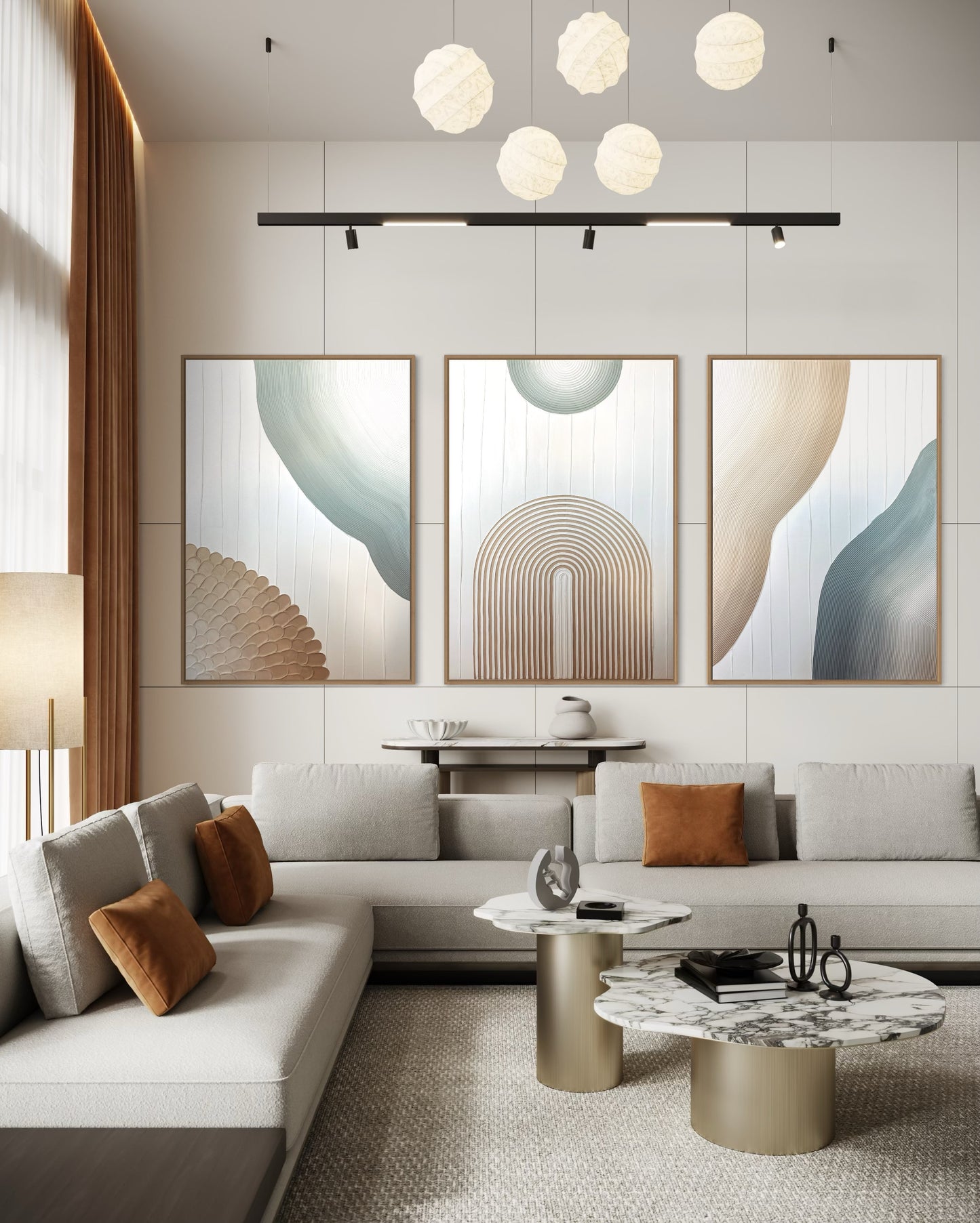 Modern living room with abstract textured set of 3 wall art, a sofa, and decorative items.