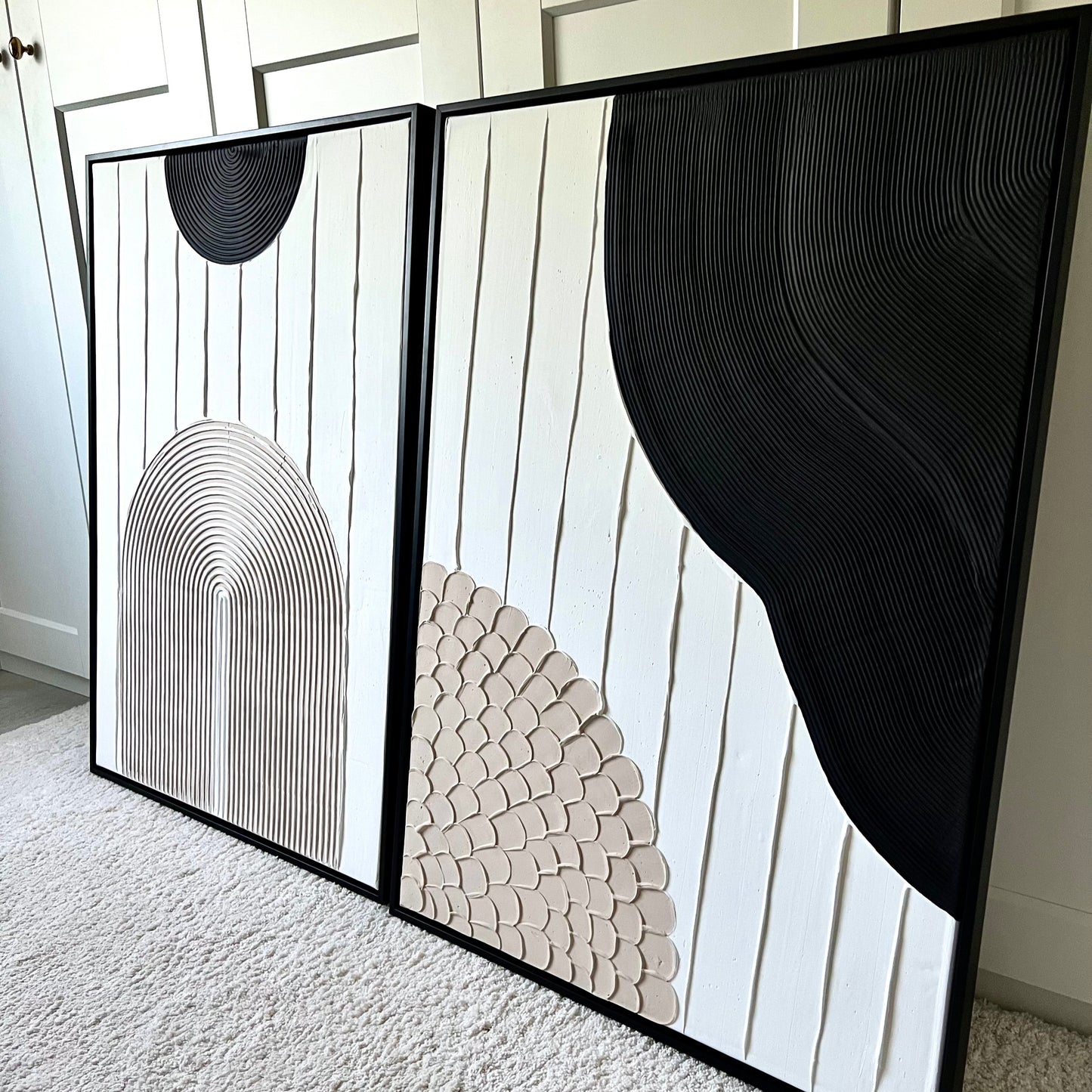 set of 2 textured wall art in white, beige, and black with arch design