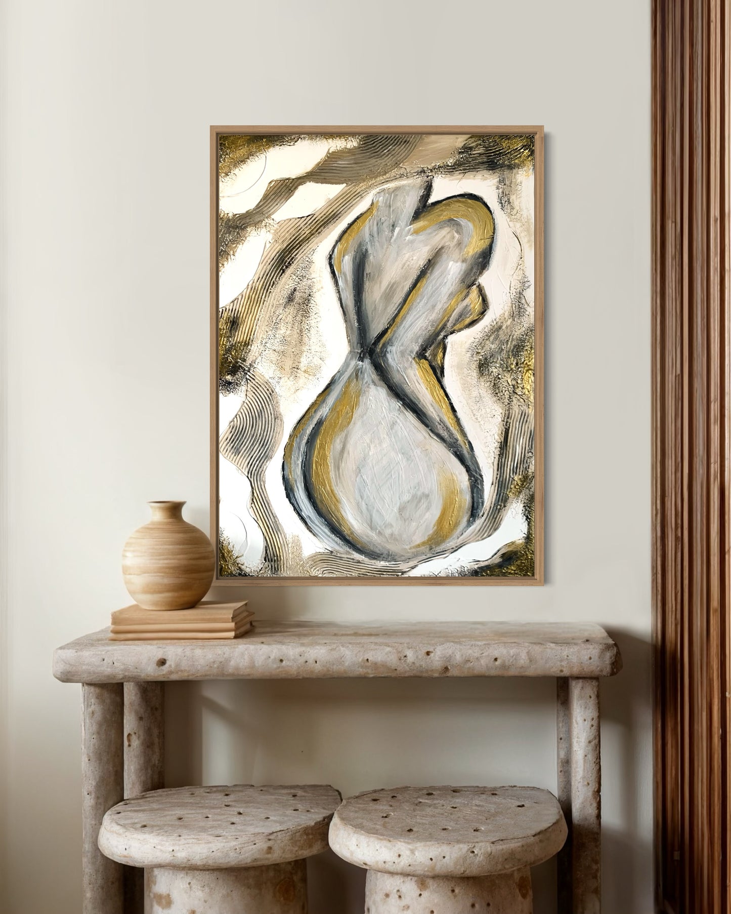 Handcrafted wall art featuring minimalist feminine form in beige and gold