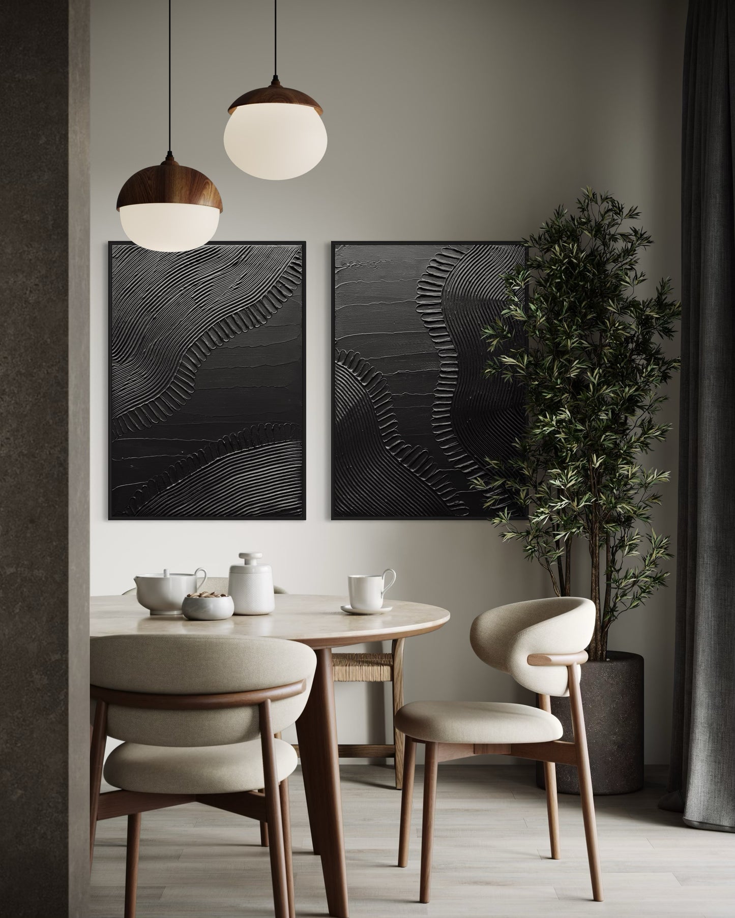 Dining room with round table, chairs, and black abstract minimalist paintings