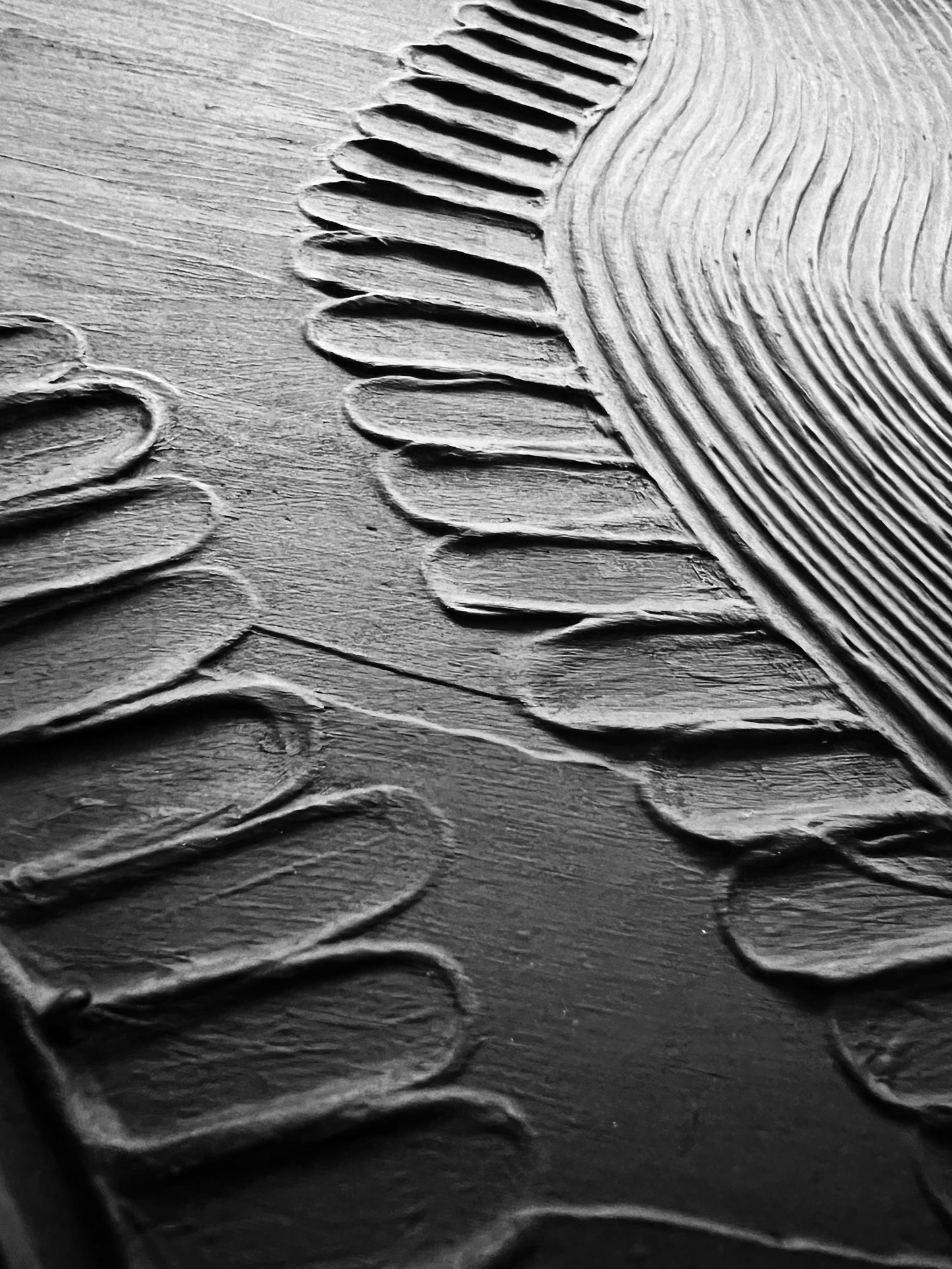 Close-up of textured surface of painting with wavy patterns