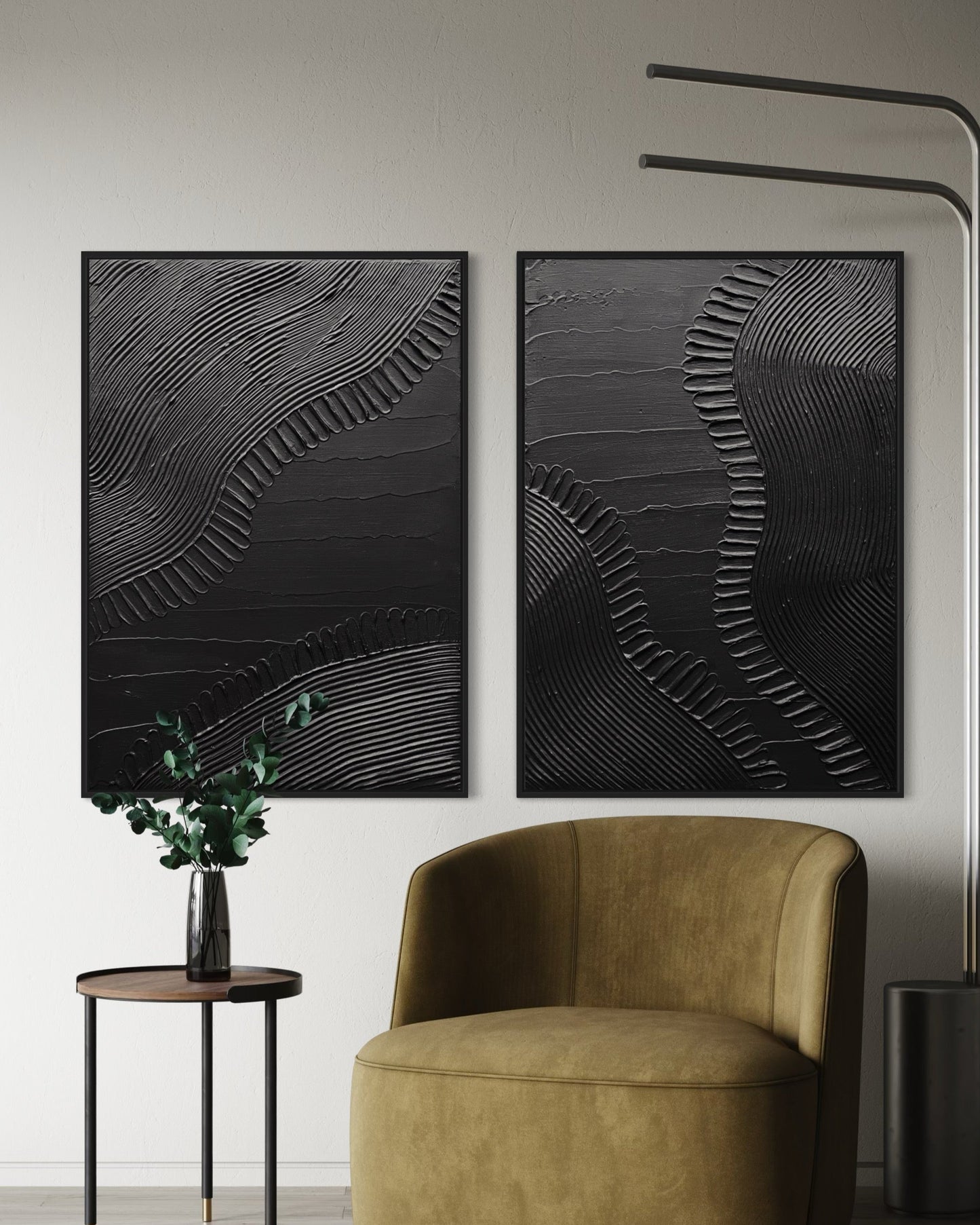 Modern interior with a brown armchair, side table, and abstract wall art in black