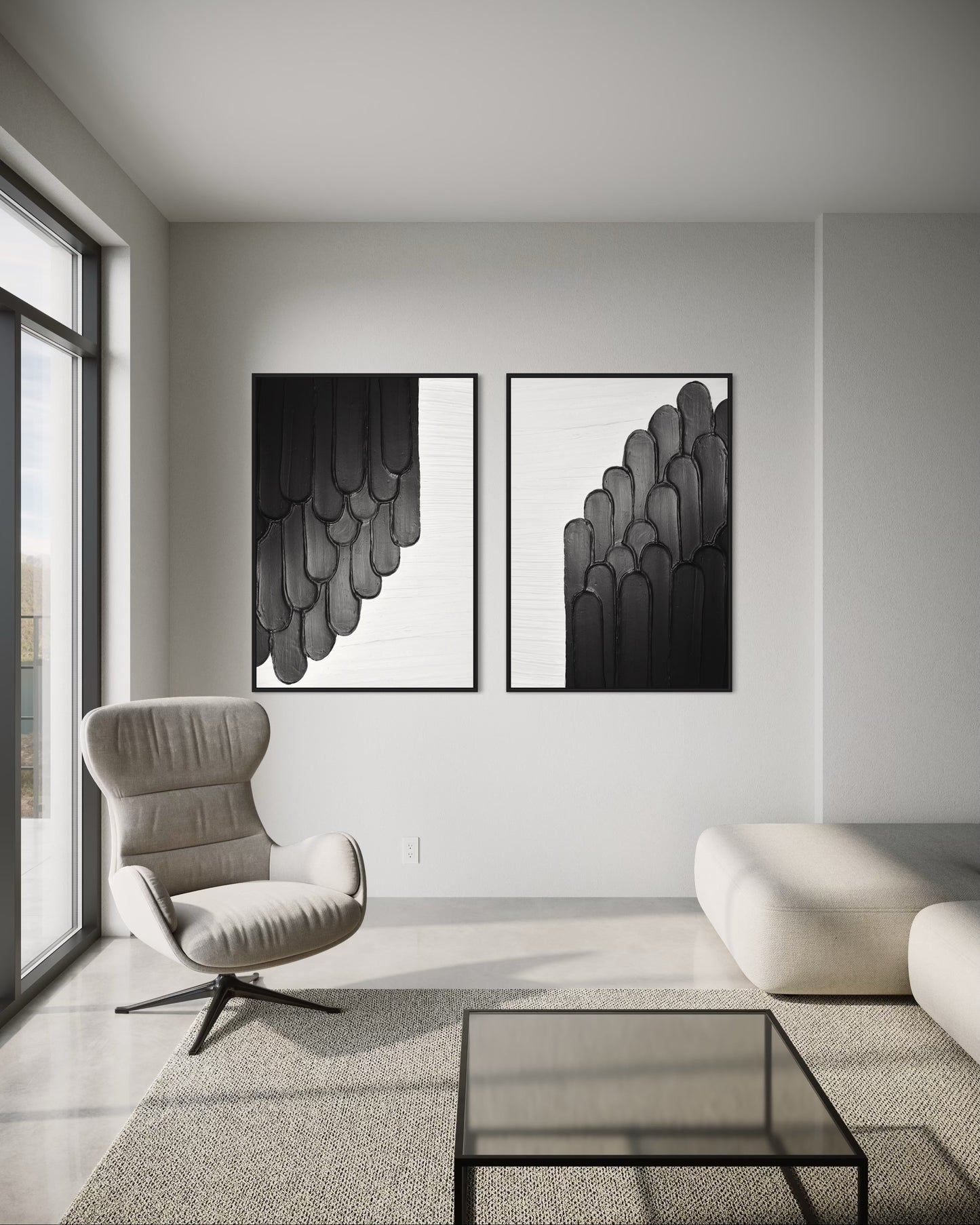 Modern living room with a gray armchair, glass coffee table, and two black and white abstract wall art pieces.