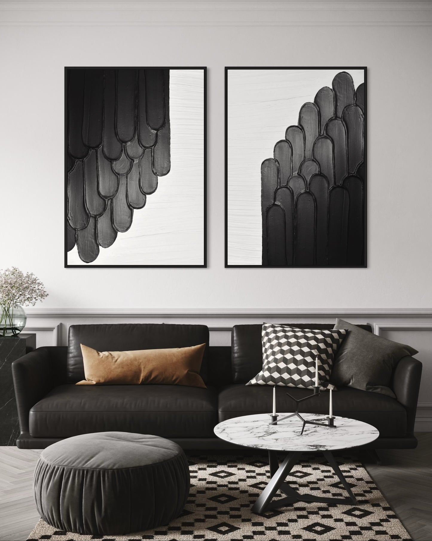 Modern living room with black sofa, round ottoman, and abstract modern textured art on the wall.