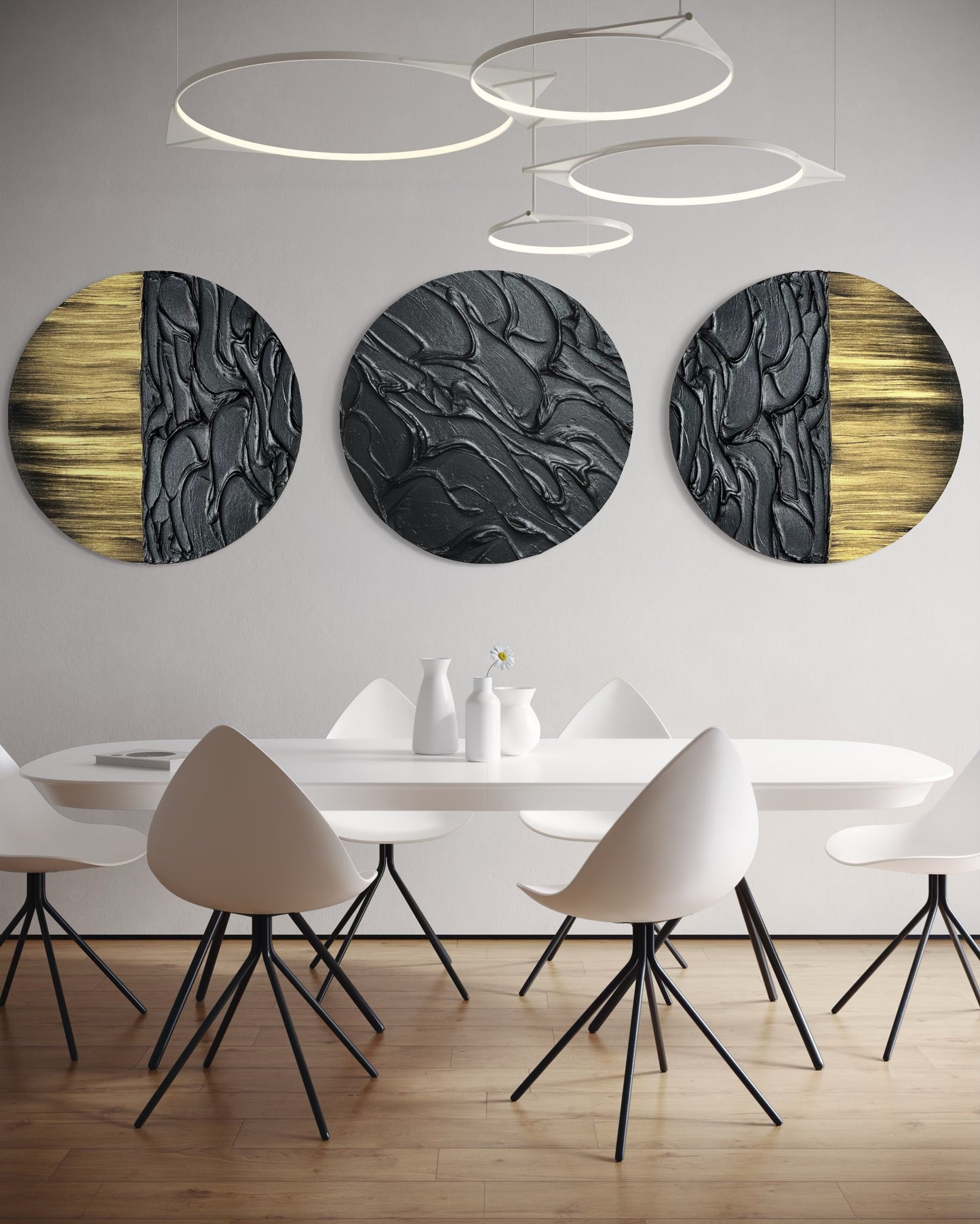 Sculptural black textured wall art with metallic gold accents in set of three