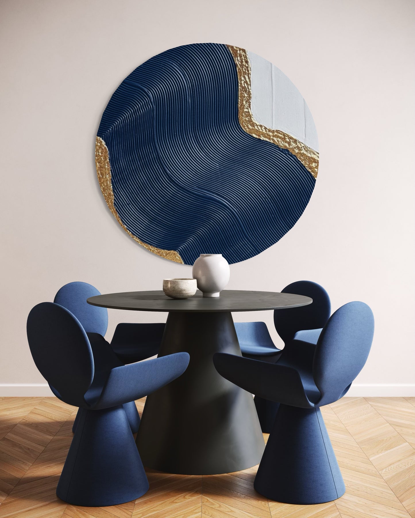 Modern dining set with blue chairs and a black table against a wall with a circular blue artwork.