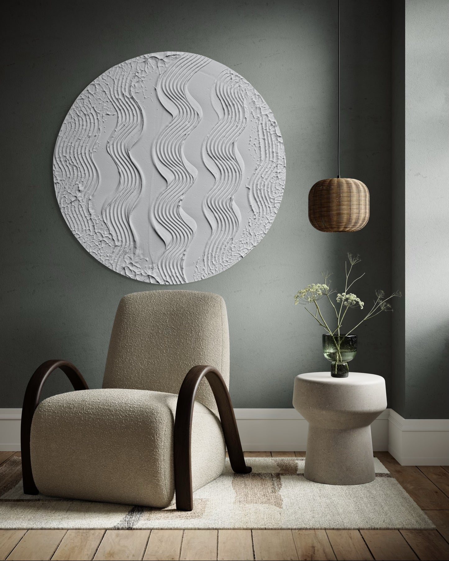 Modern interior with a textured wall art piece, beige armchair, and small round table.
