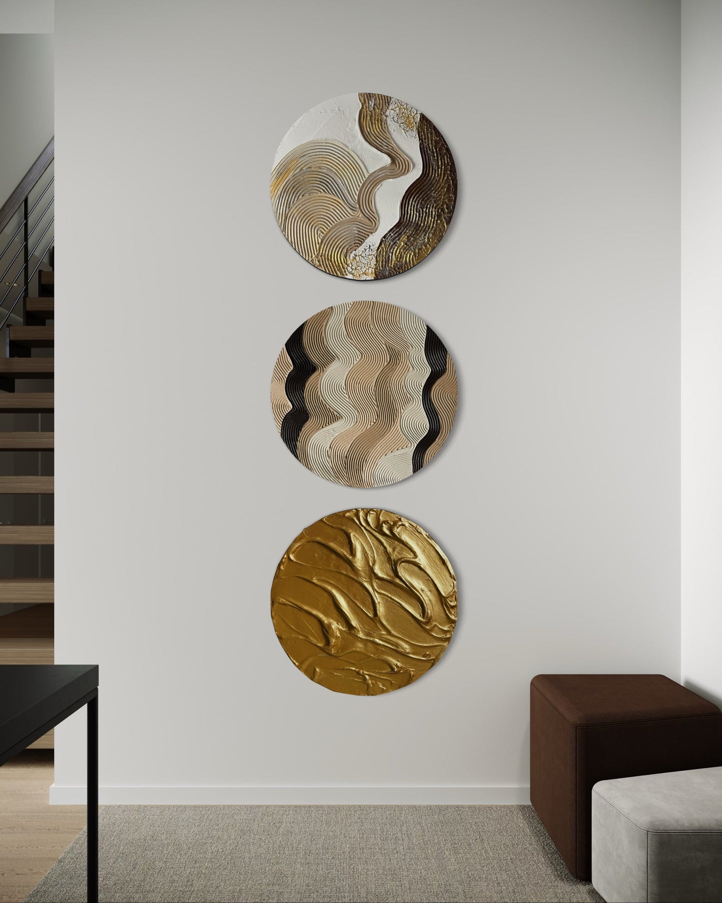 Three circular wall art pieces on a white wall in a modern interior setting.
