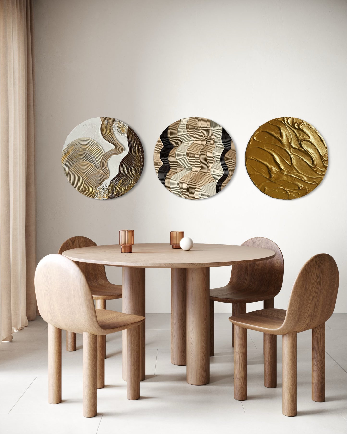 Wooden dining table with chairs and set of 3 round textured abstract wall art in a room.