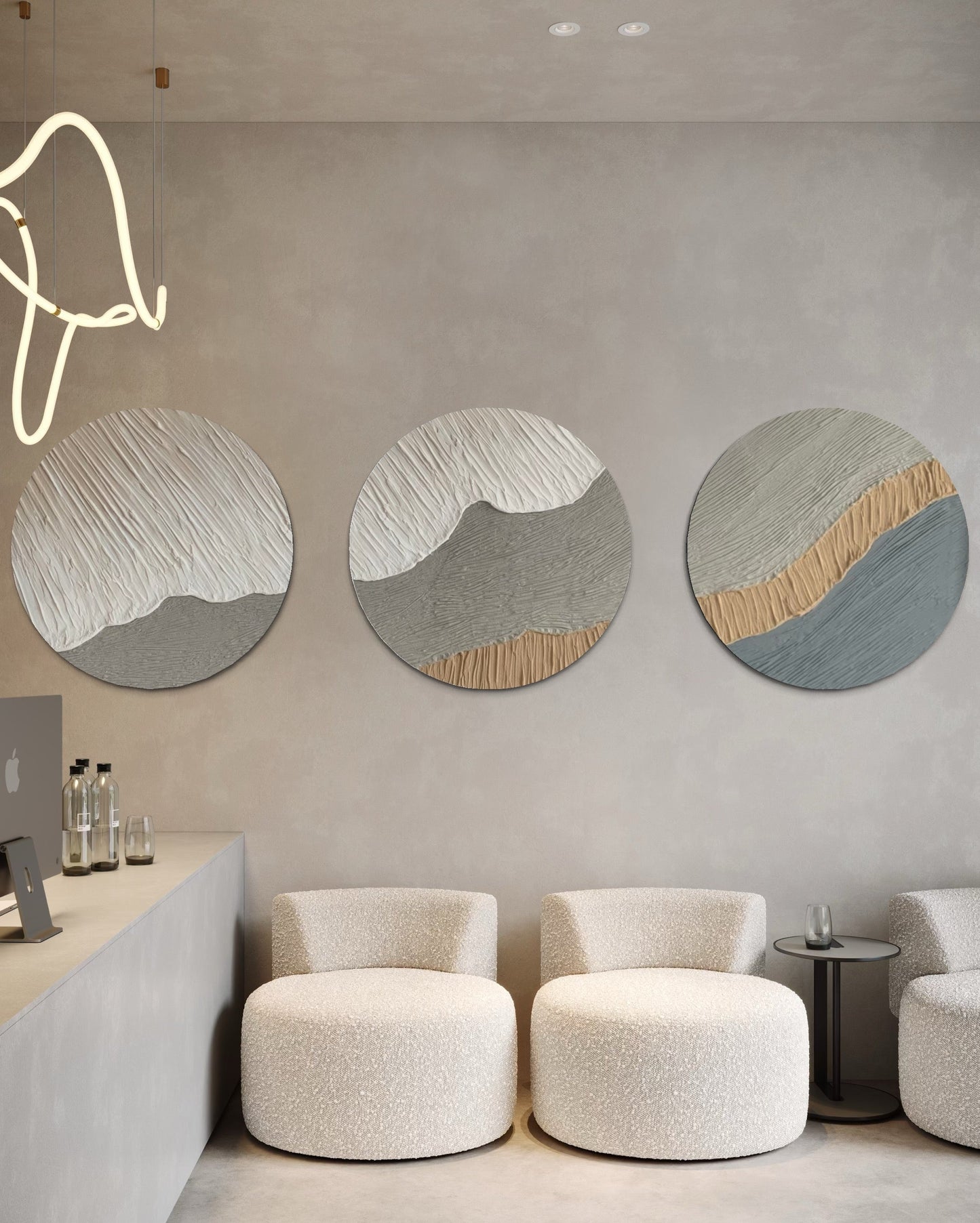 Modern interior with round abstract wall art set of 3 and white chairs.