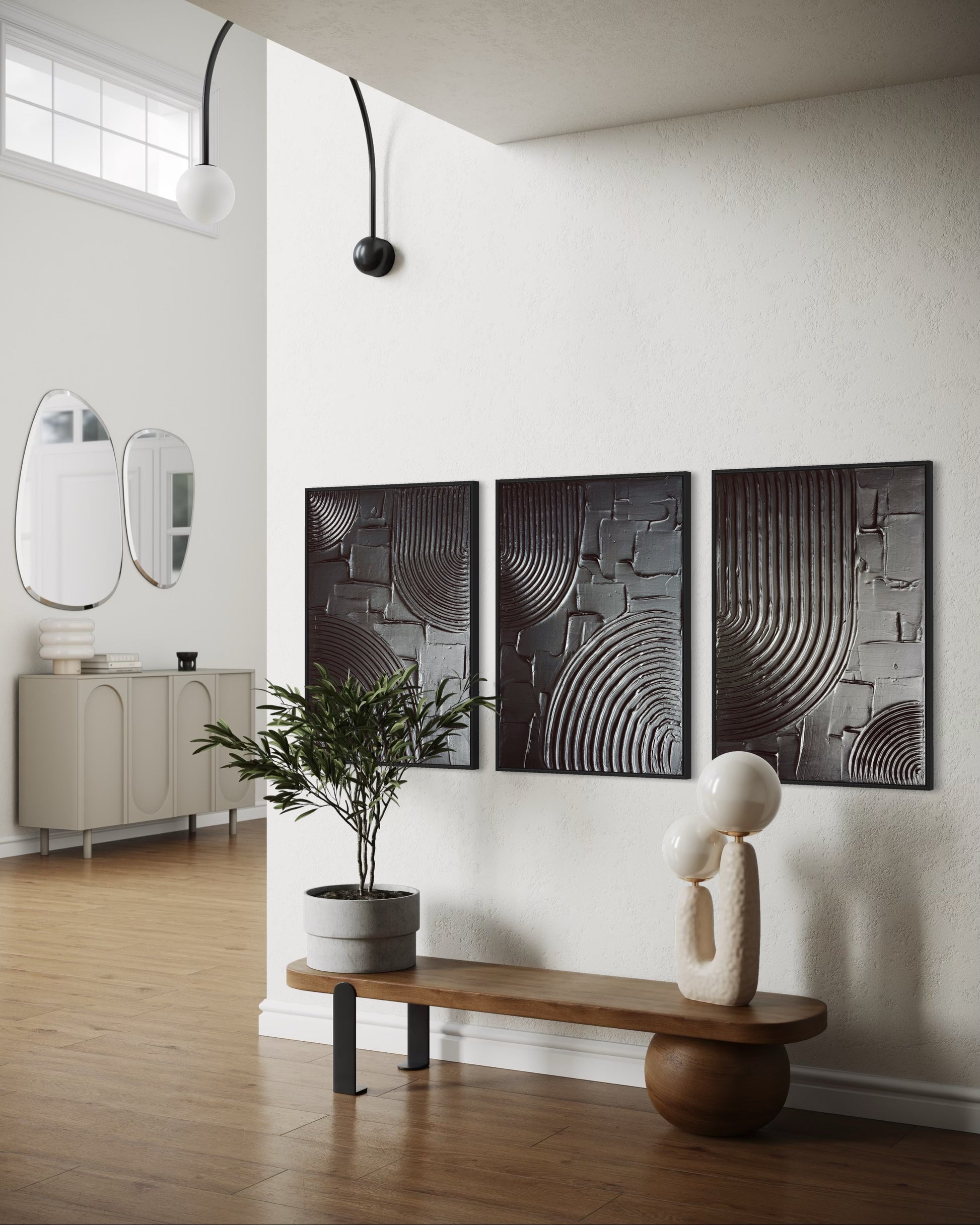 Modern interior with modern abstract wall art in black, a bench, and a plant.