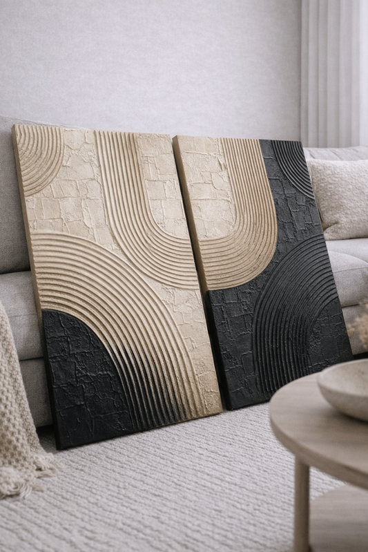 Two abstract  modern minimalist textured wall art pieces in a living room setting.