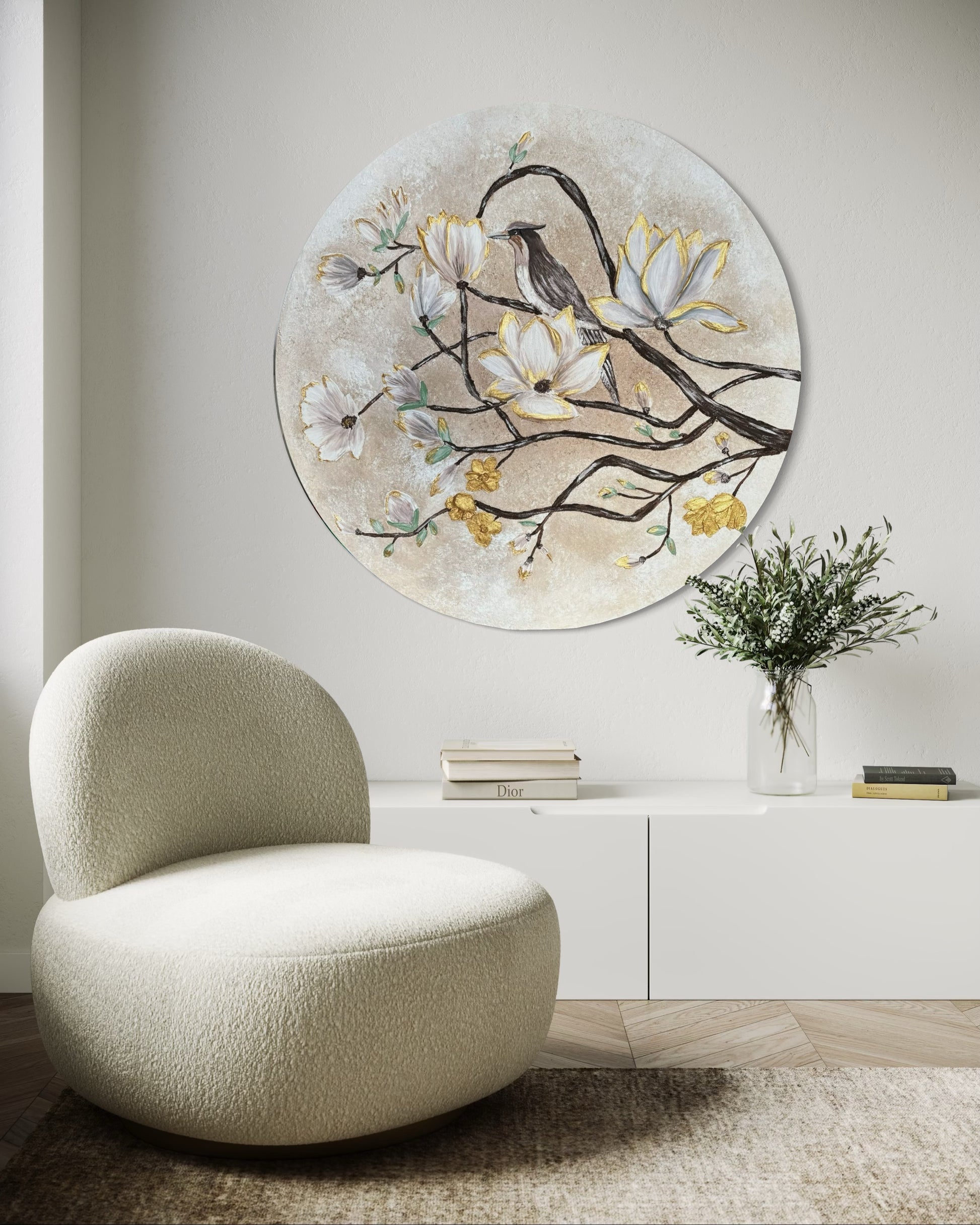 Modern beige chair in a room with a decorative wall piece featuring a bird and flowers.