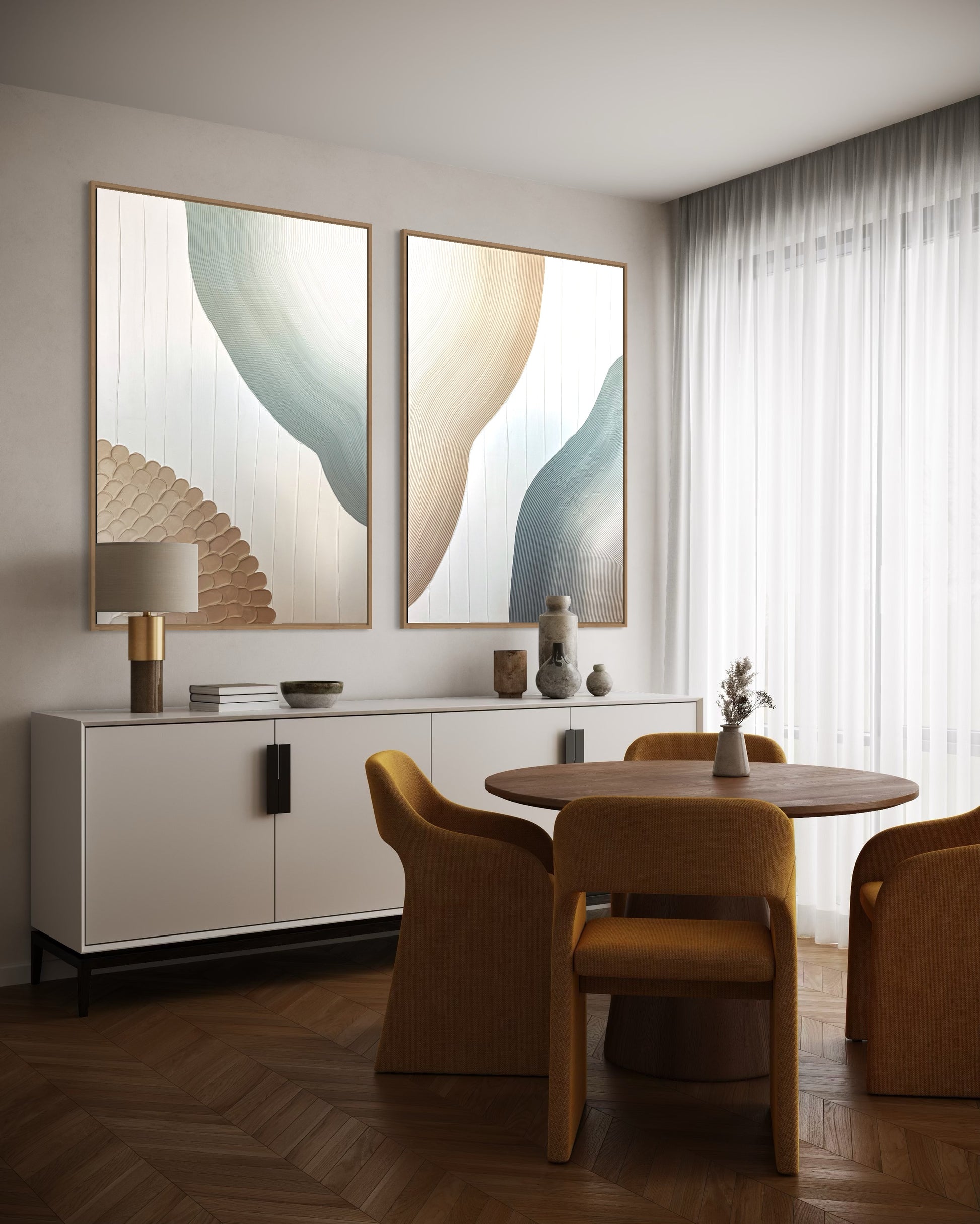 Modern dining room with abstract art, a table, and chairs.