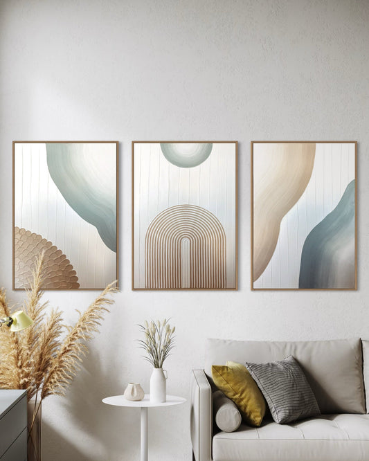 Modern living room with abstract wall art set of 3 , a sofa, and decorative elements.