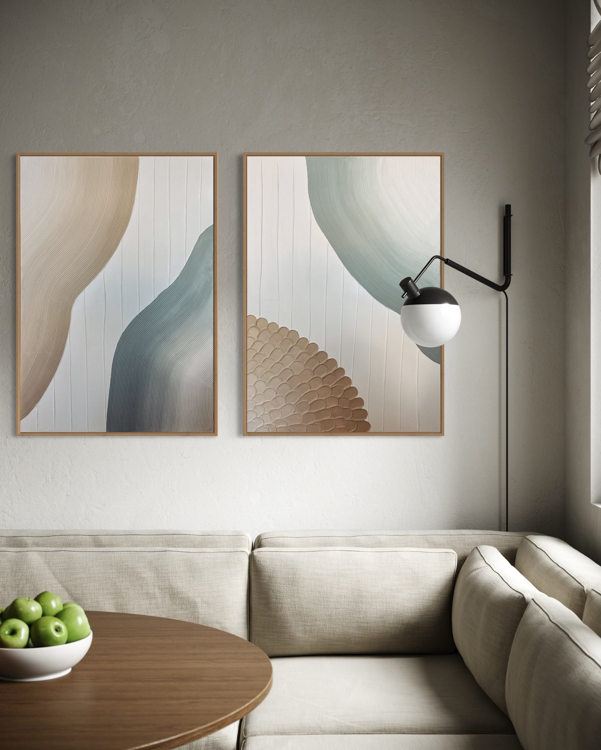 Modern living room with abstract wall art and a lamp.