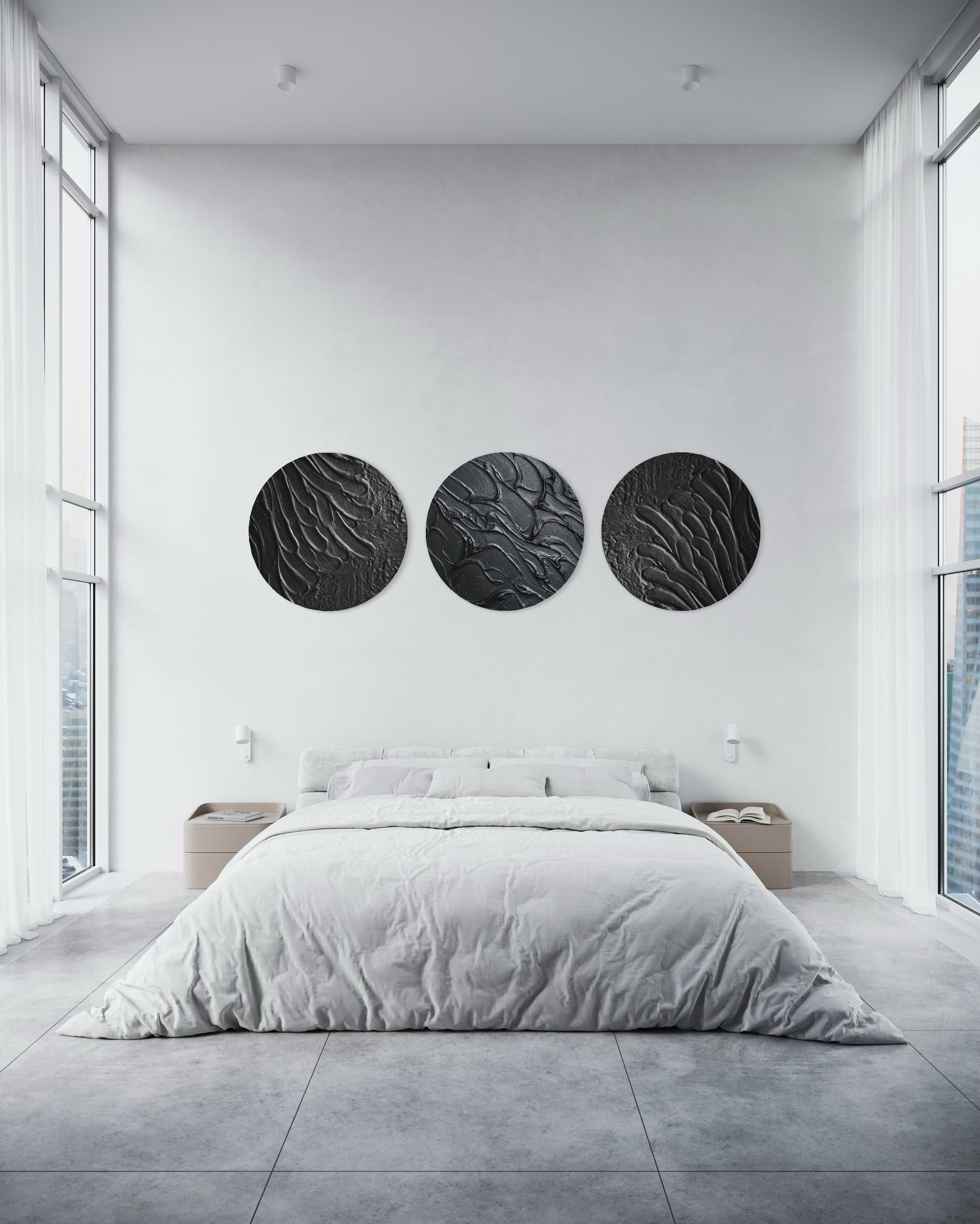 Modern bedroom with a bed and three circular wall art pieces.