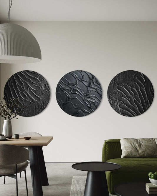 Modern living room with three circular wall art pieces, a green sofa, and a dining table.