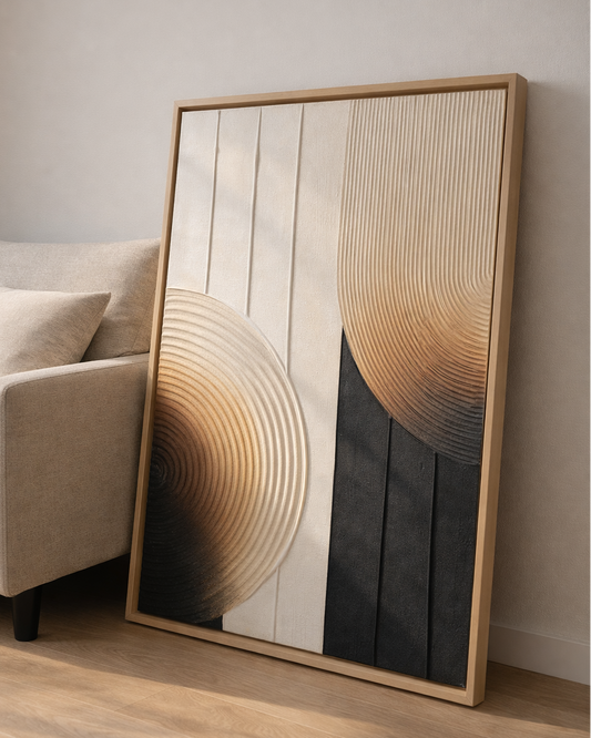 Abstract wall art with concentric circle design in a wooden frame on a neutral wall.