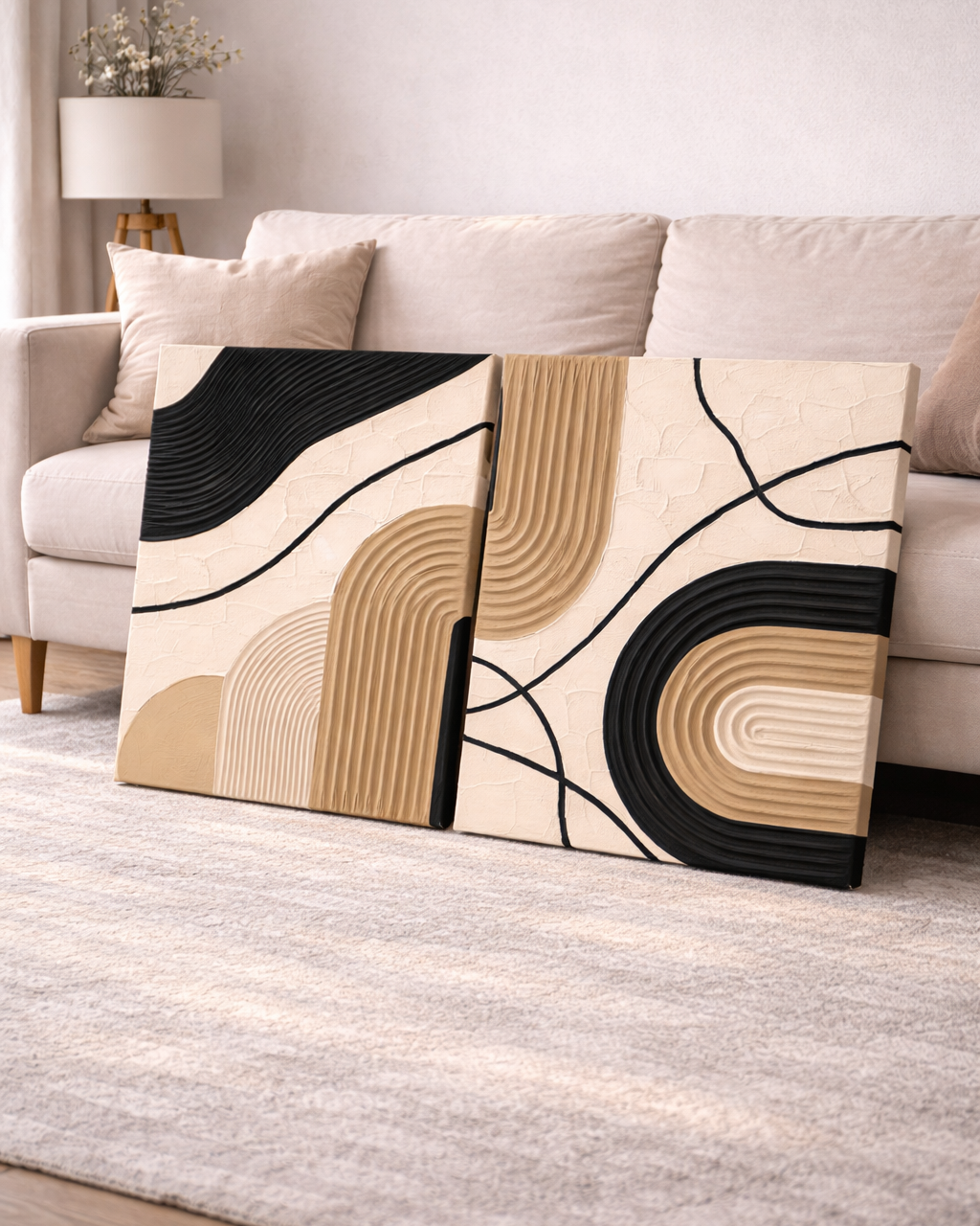 Abstract textured wall art piece on a sofa in a living room setting