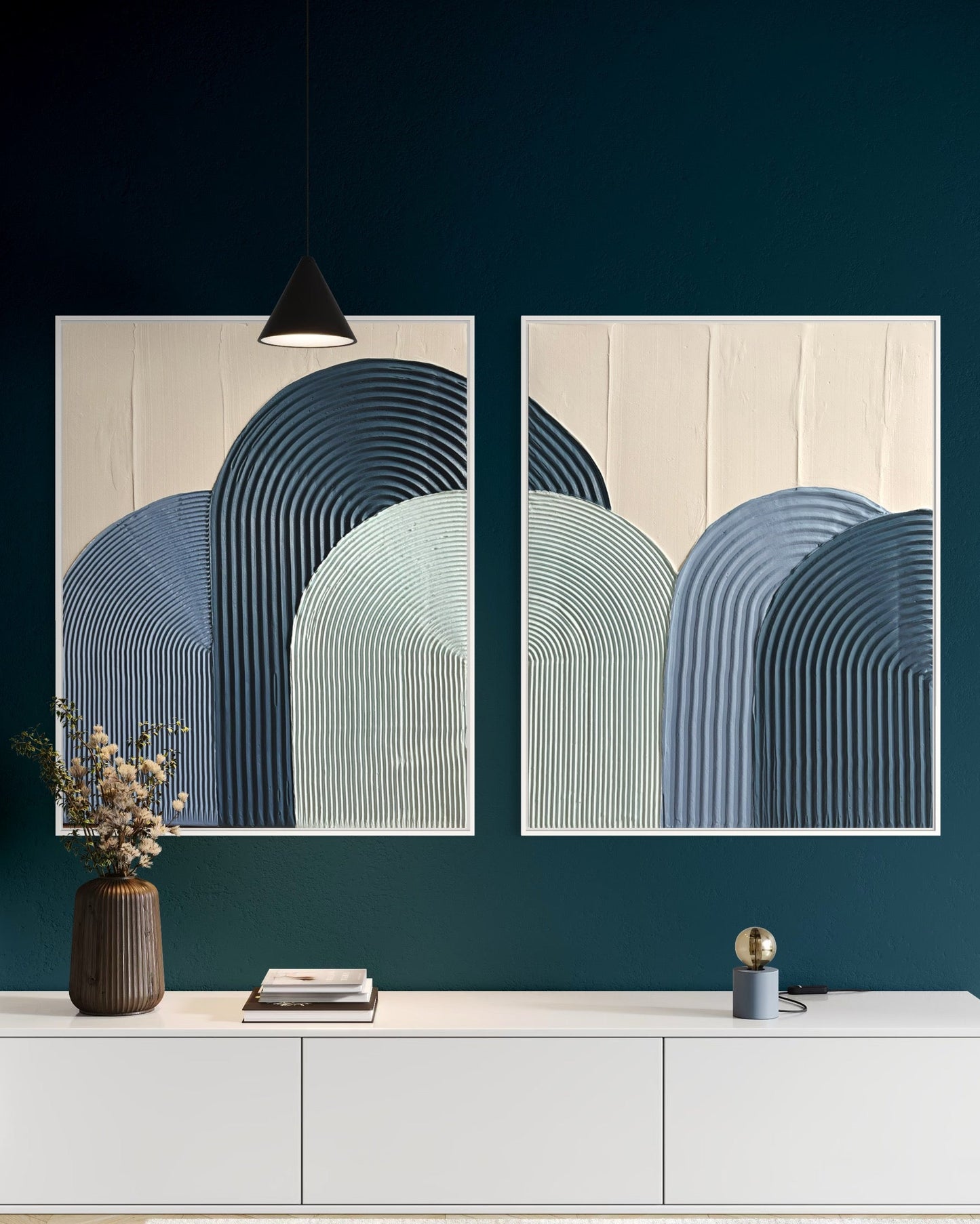 Modern interior with abstract textured wall art in blue and a white console table.