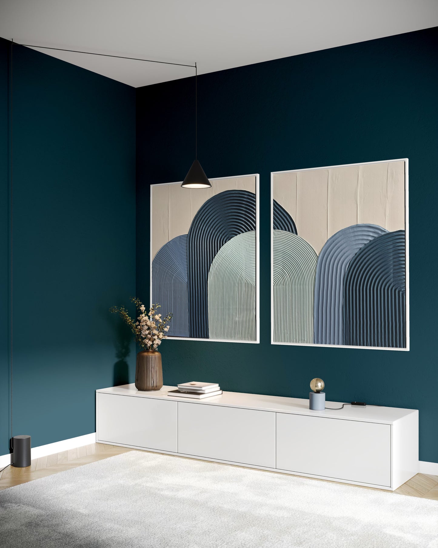 Modern interior with two abstract wall art pieces on a dark blue wall.