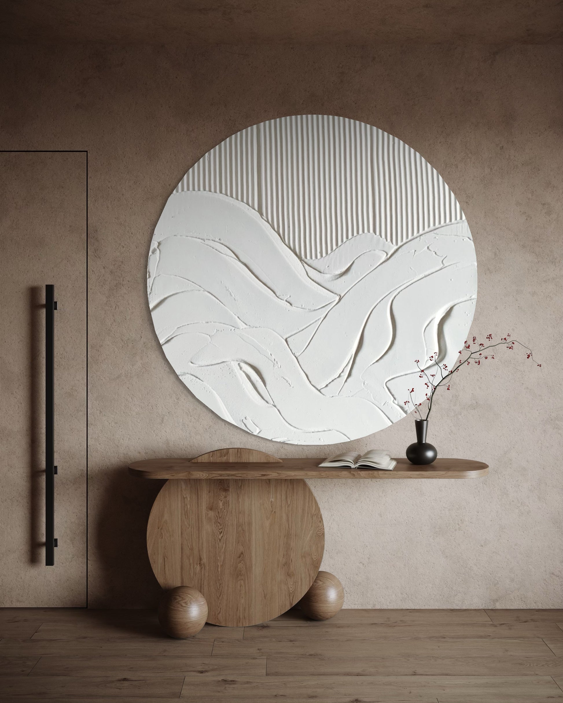 Round abstract wall mirror on a wooden stand against a beige wall.