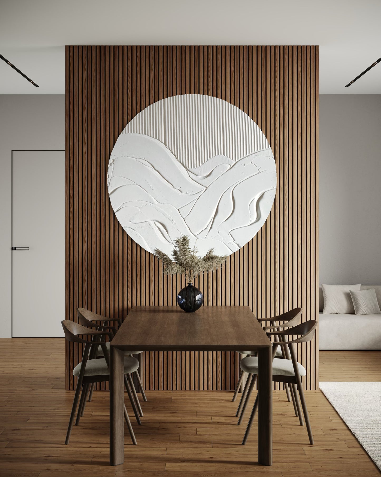Dining room with wooden table and chairs, decorative wall art, and a couch.