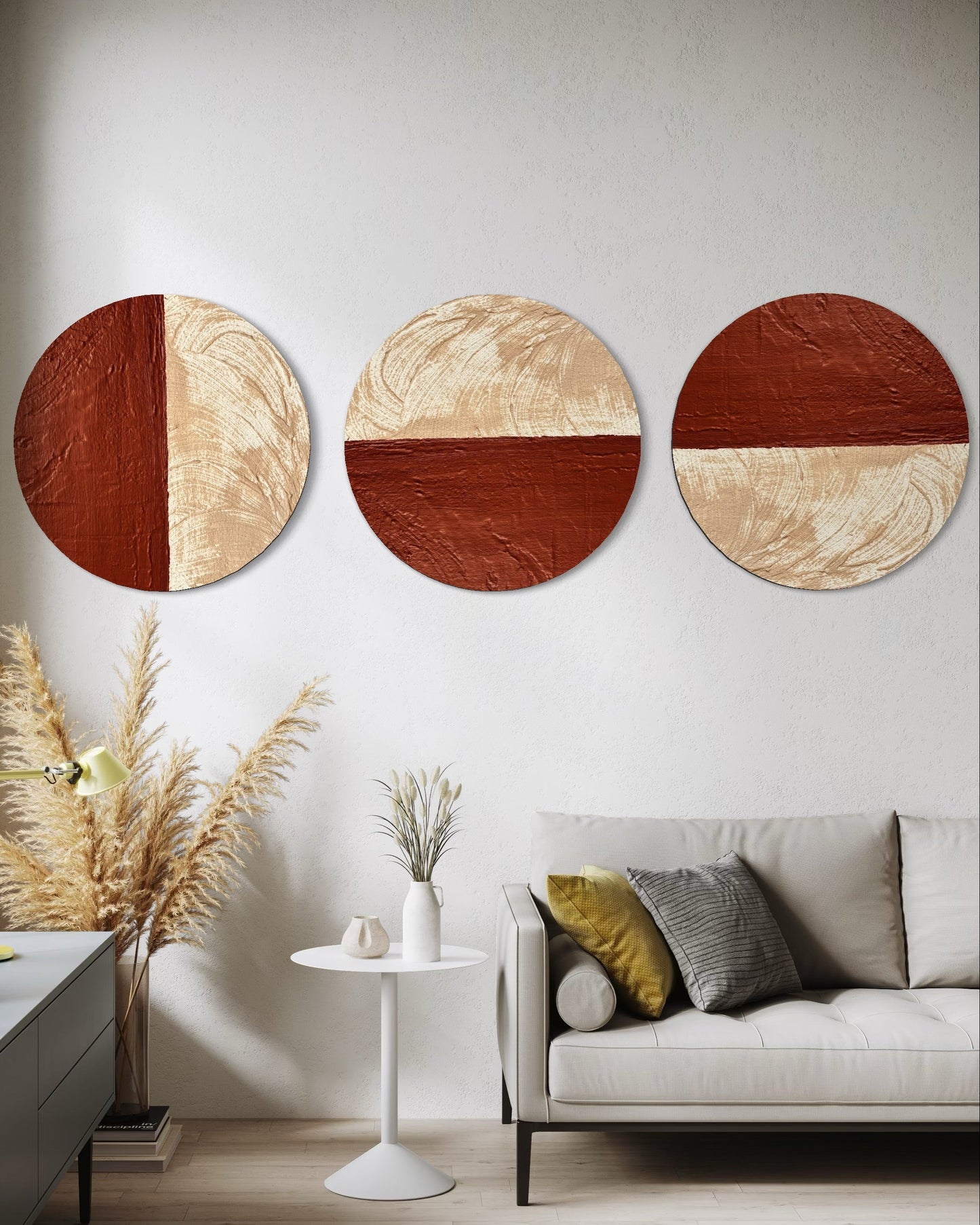Three circular wall art pieces in a living room setting with a sofa and decor.
