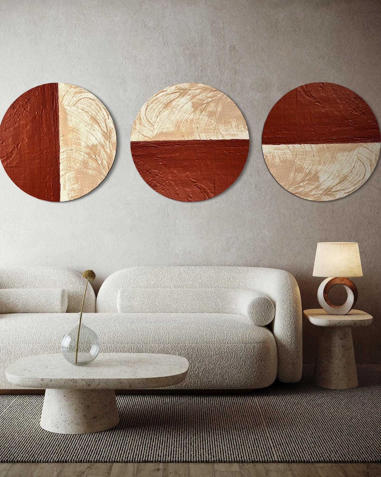 Modern living room with a beige sofa, round side tables, and abstract wall art.
