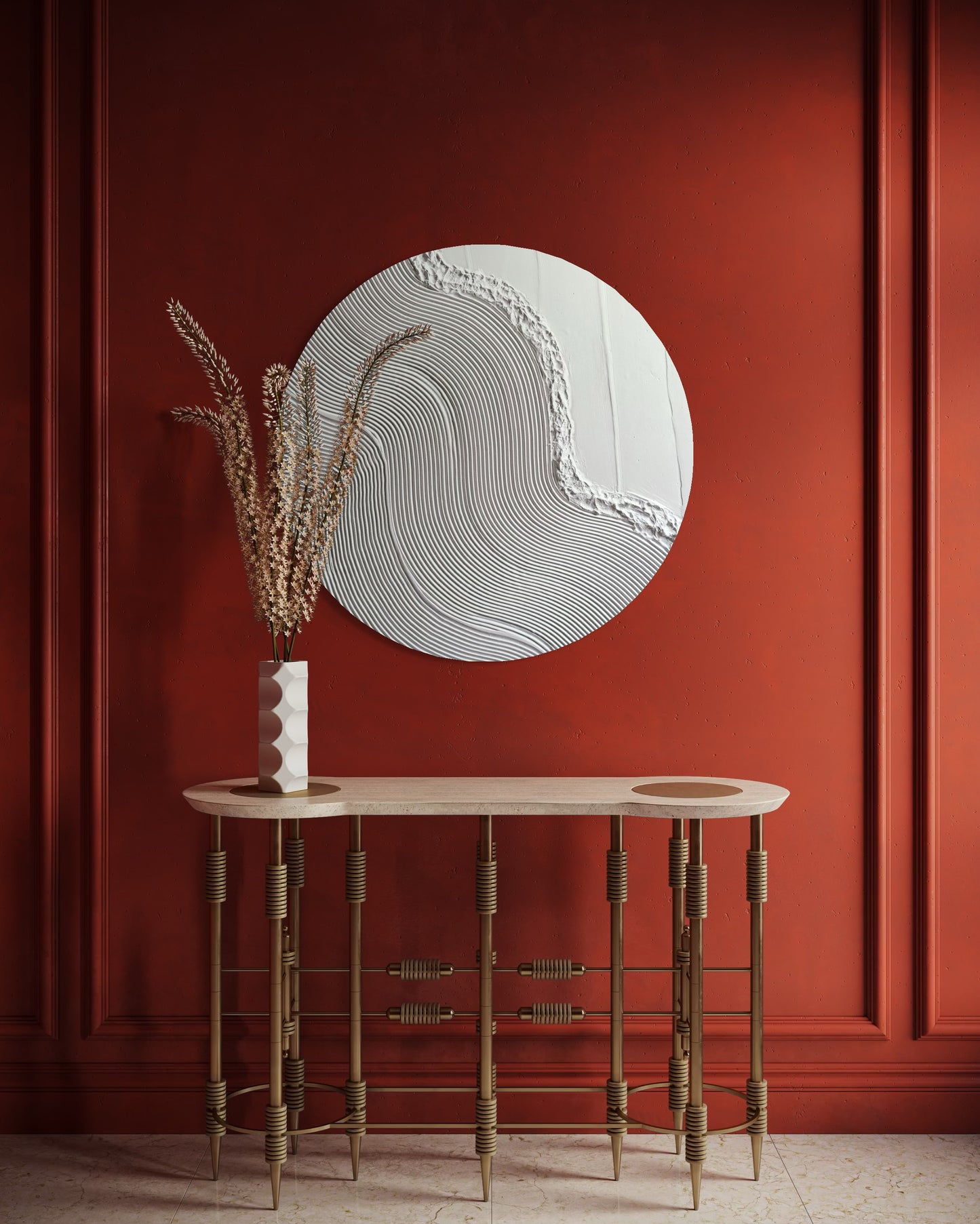 Round abstract wall art piece on a red paneled wall with a wooden console table and decorative elements.