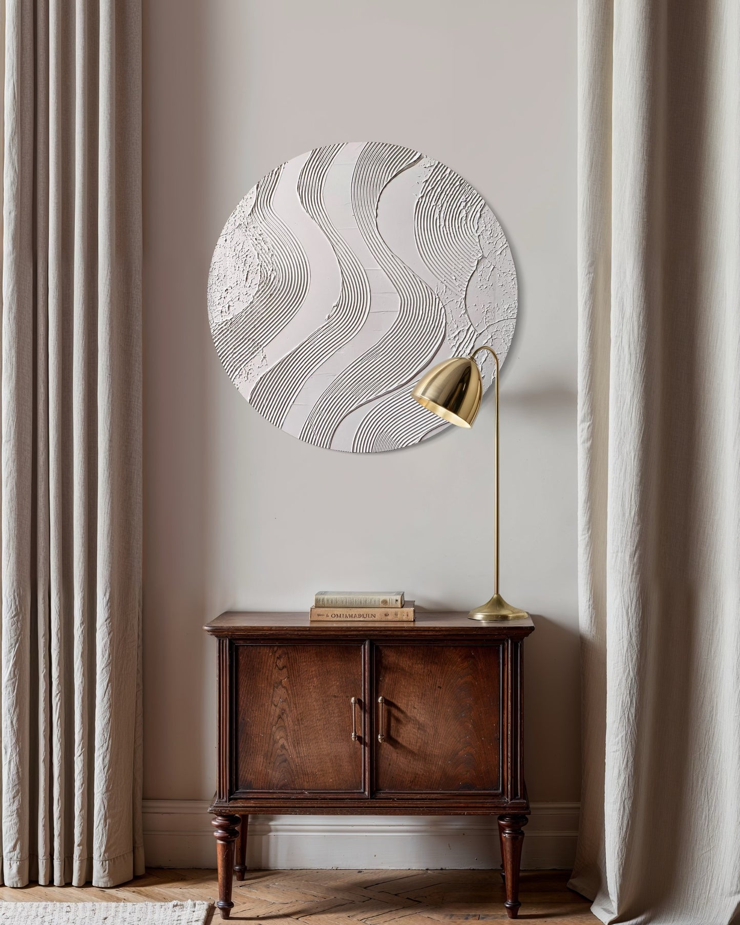 Decorative wall art with wavy pattern on a neutral wall above a wooden cabinet.