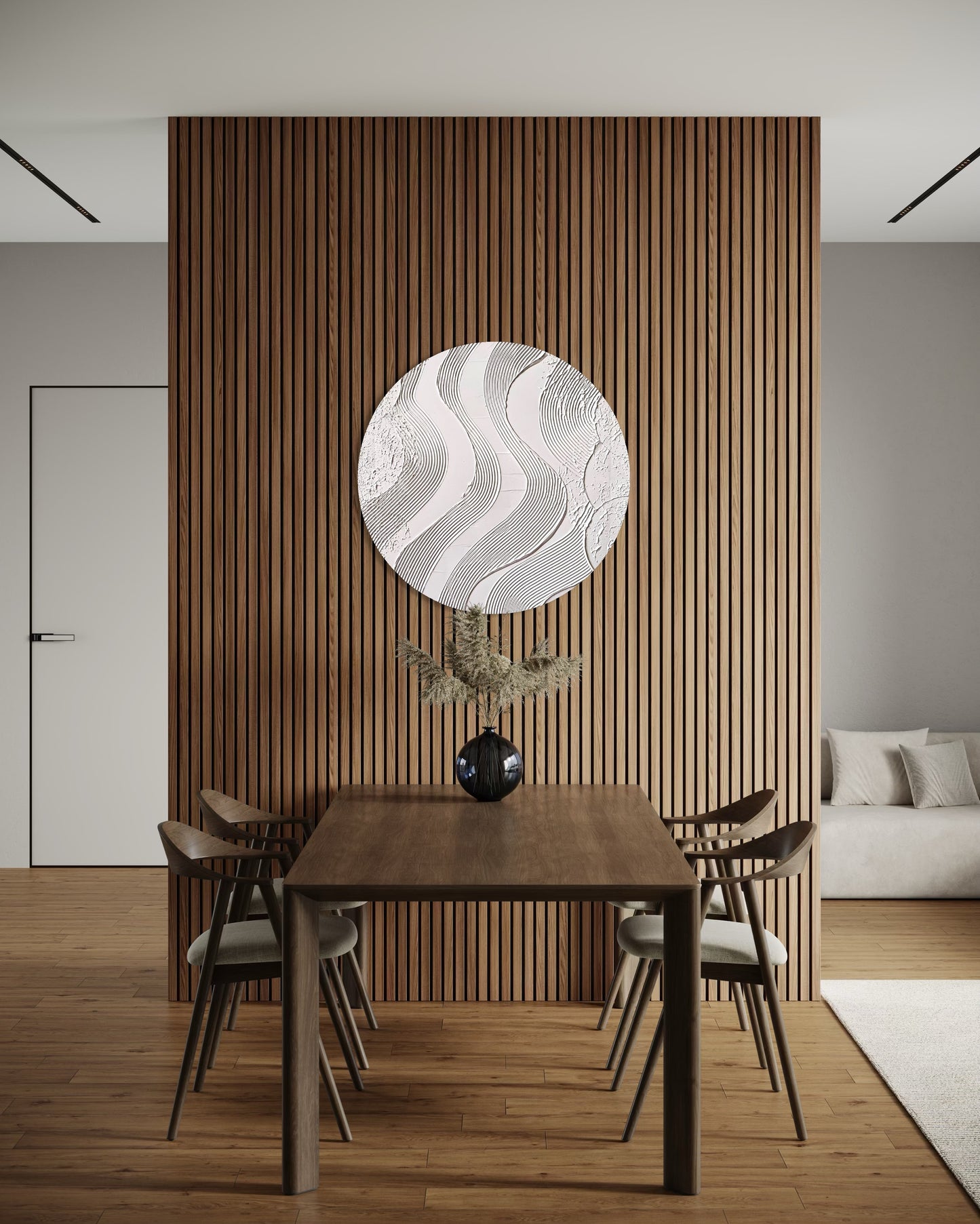 Dining room with wooden table and chairs, decorative wall art, and a couch.