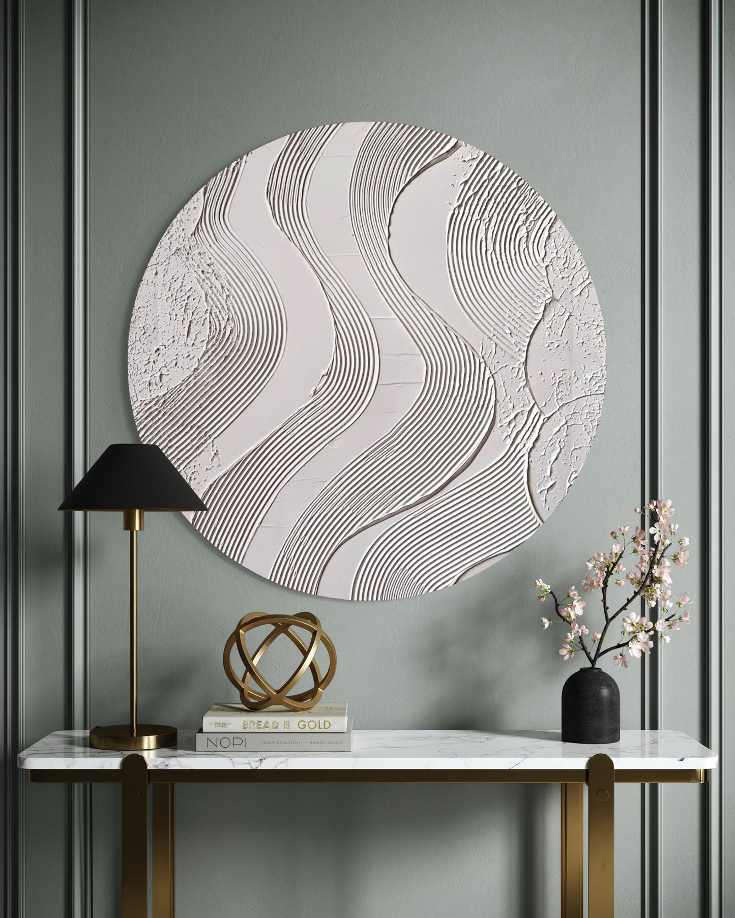 Decorative wall art with wavy patterns on a gray wall above a marble console table.