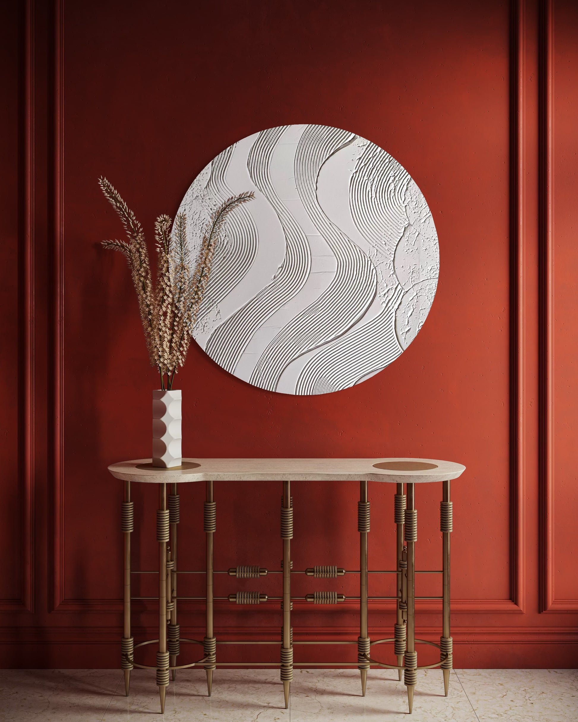 Decorative wall piece on a red wall with a wooden console table and vase.