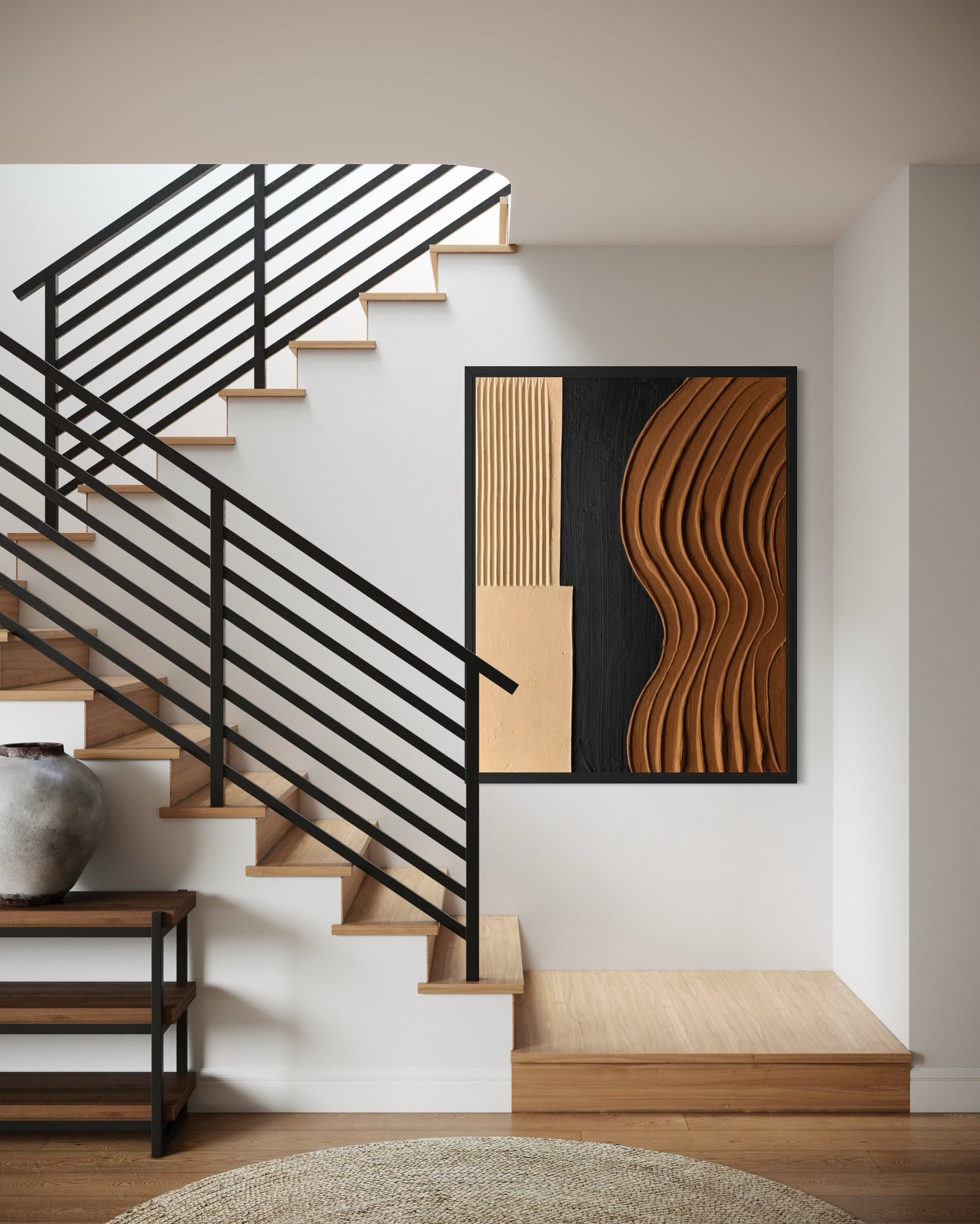 Modern staircase with black metal railing and wooden steps, featuring abstract wall art.