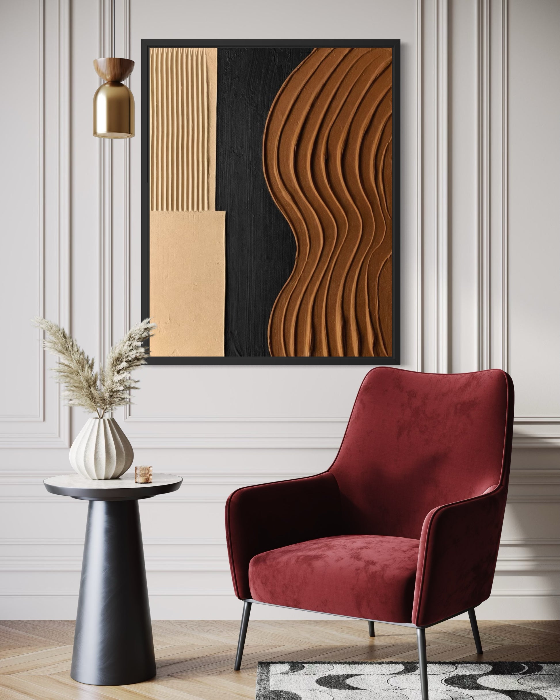 Modern interior with a red chair, side table, and abstract wall art.