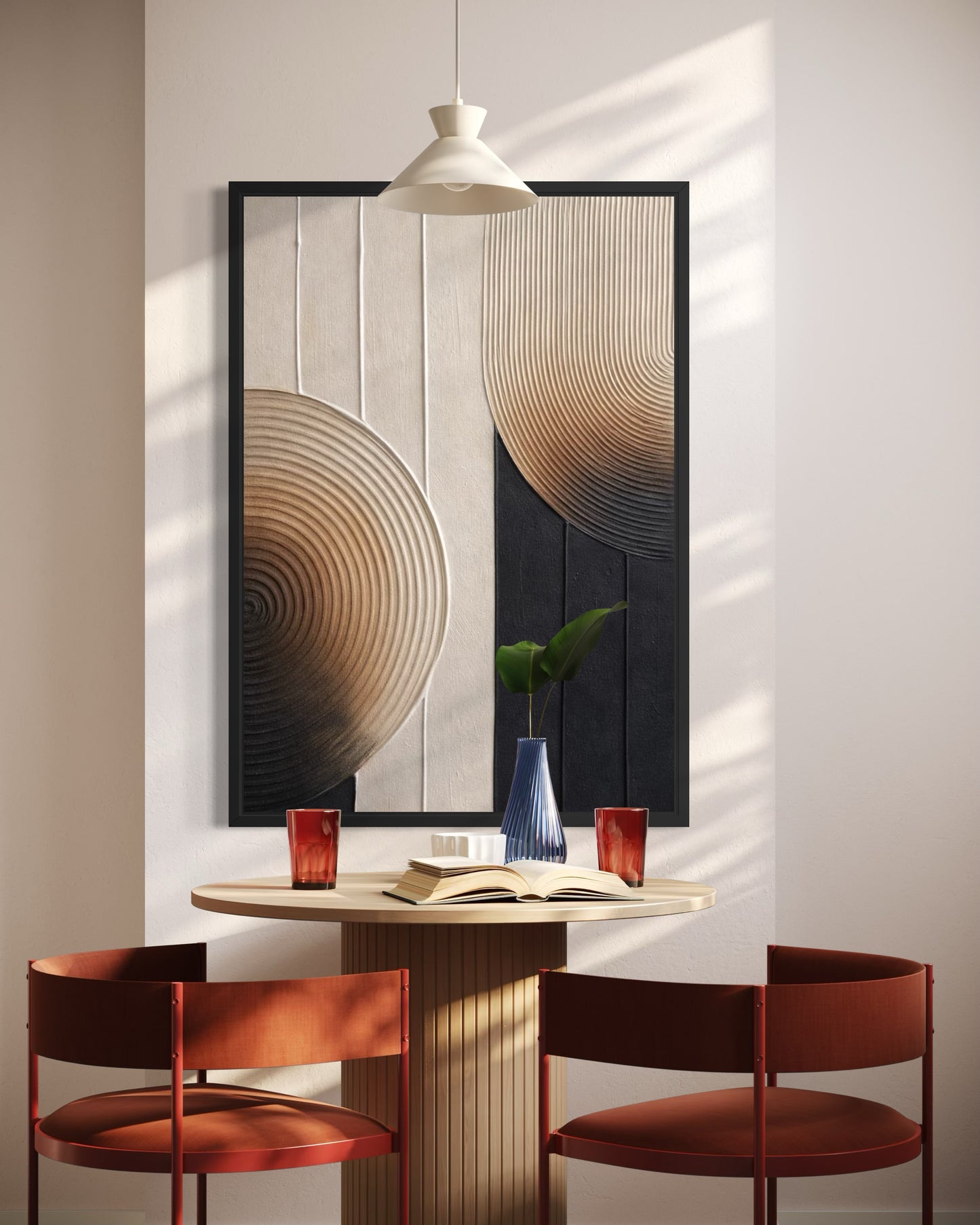 Dining area with red chairs, a small table, and abstract wall art.