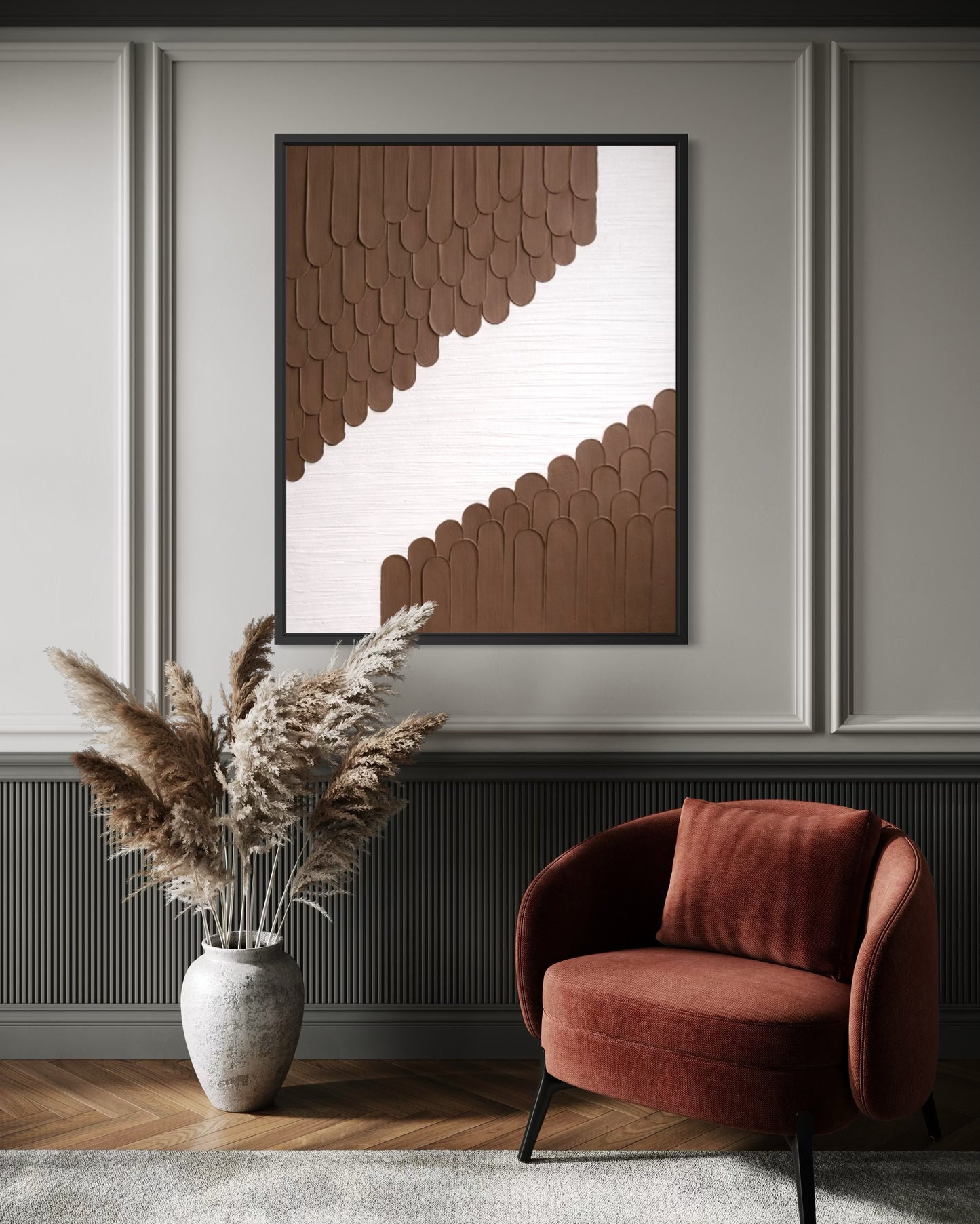 Modern interior with a red armchair, decorative vase with pampas grass, and abstract wall art.