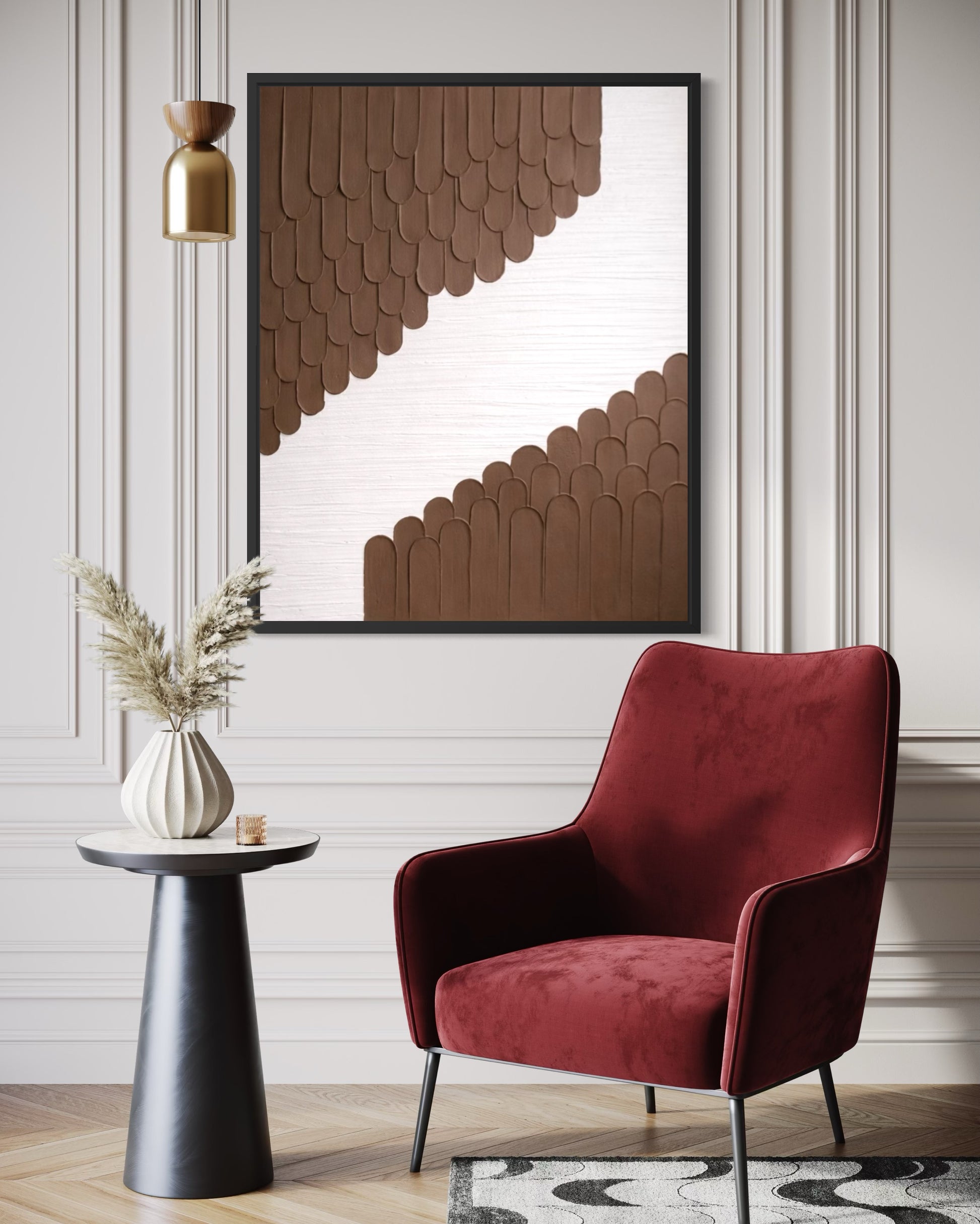 Modern interior with a red armchair, side table, and abstract wall art.