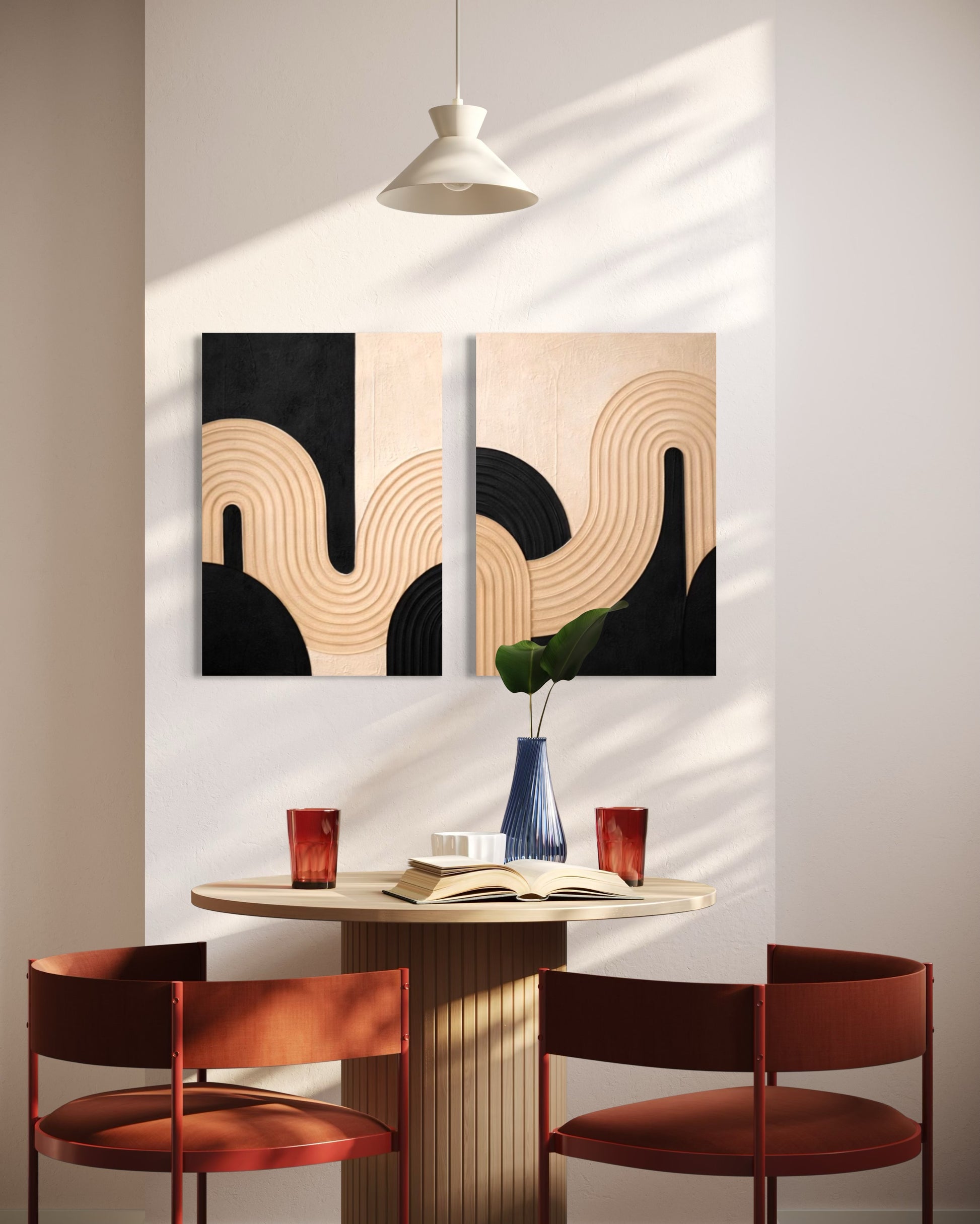 Dining area with abstract wall art, round table, and red chairs.