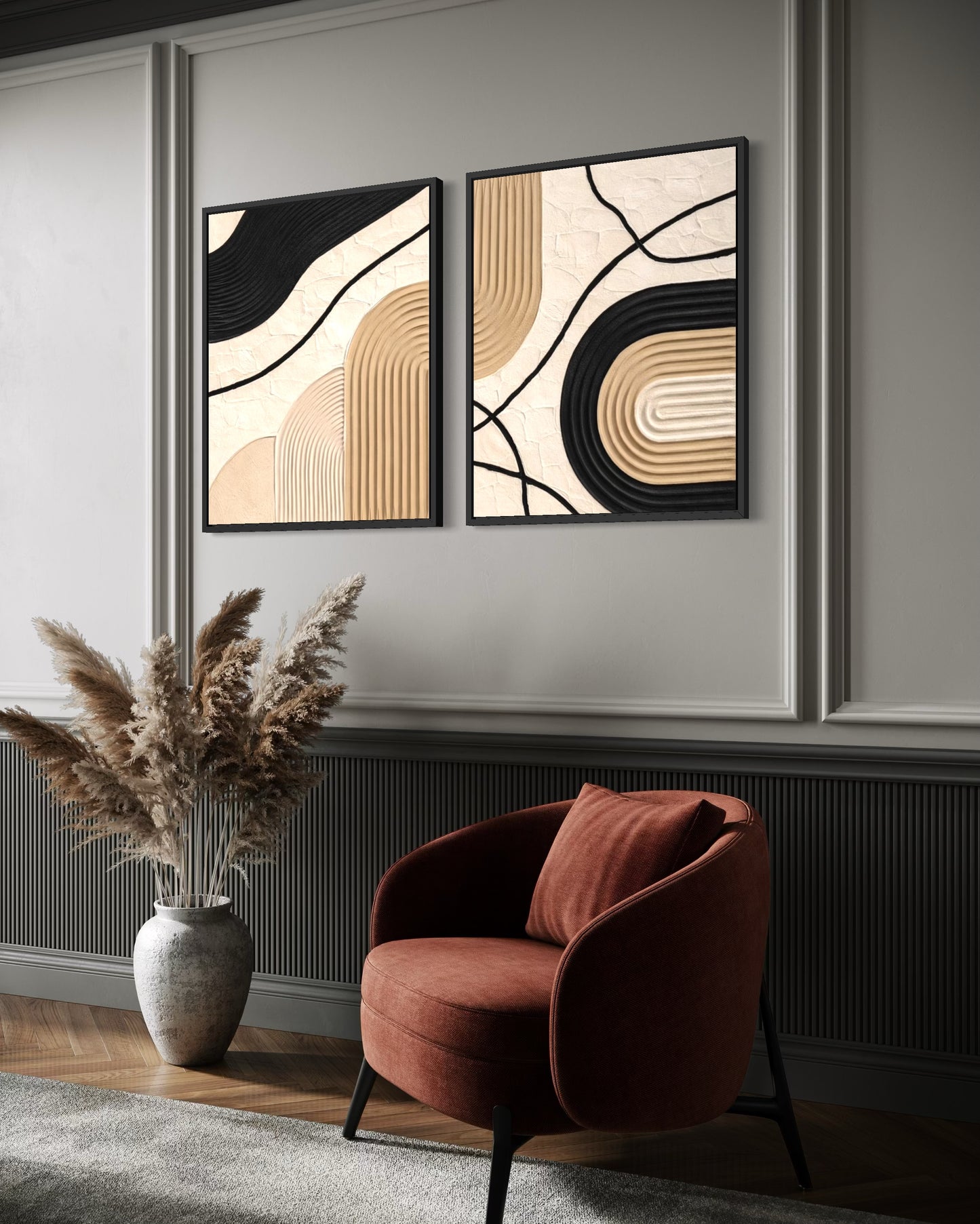 Two abstract wall art pieces above a red armchair in a room with decorative elements.