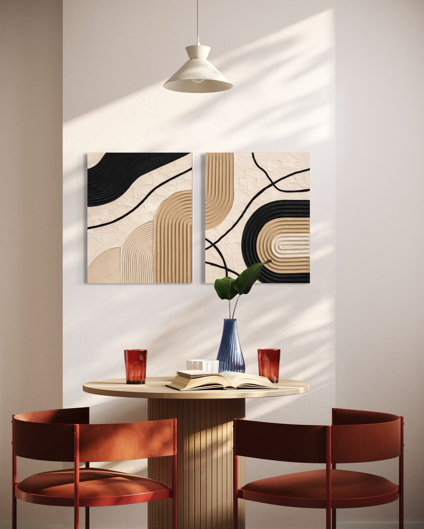 Modern dining area with abstract wall art, round table, and red chairs.