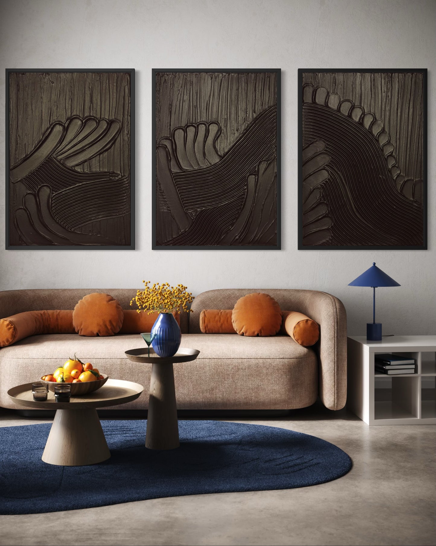 Modern living room with a beige sofa, abstract wall art, and decorative items.