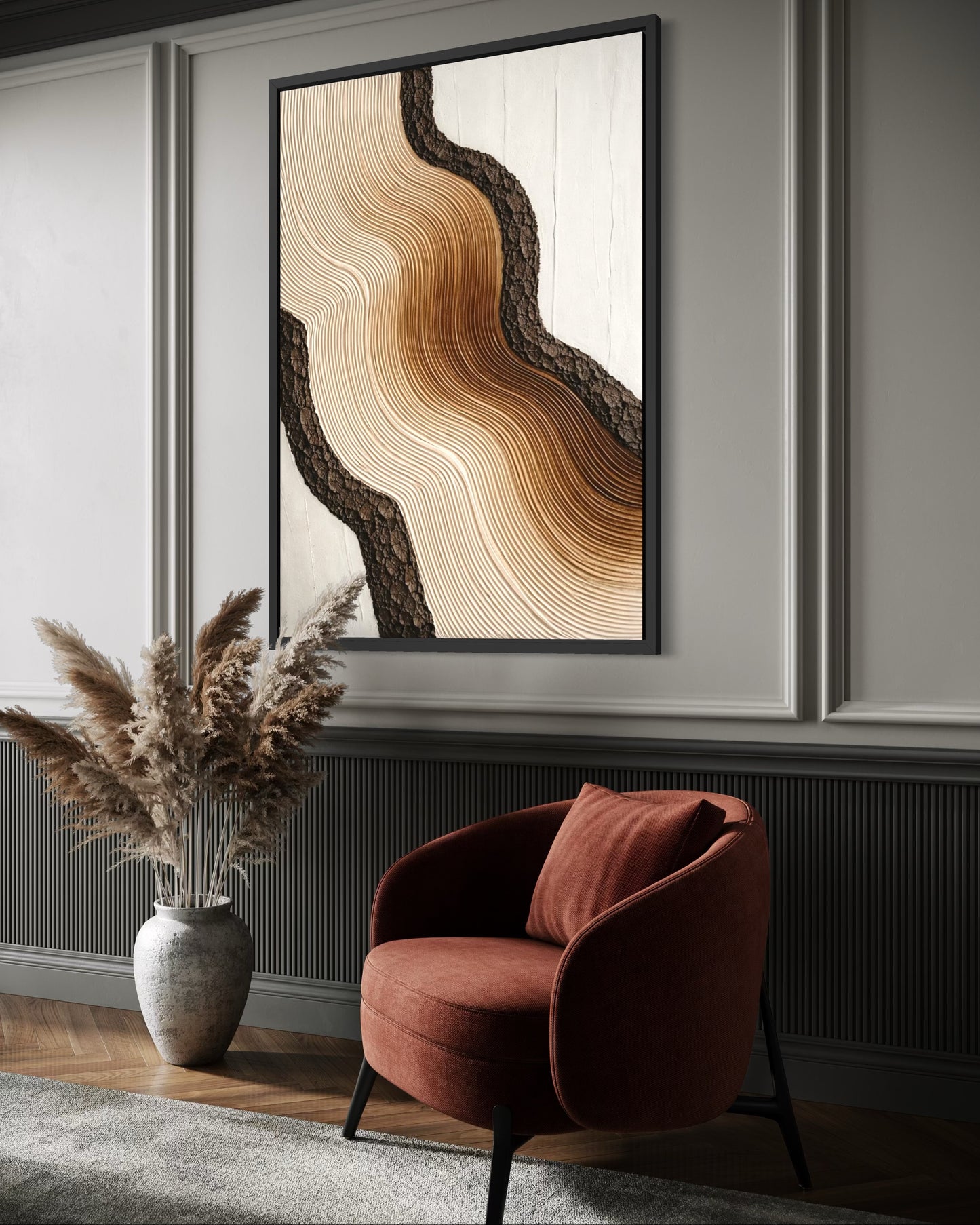 Abstract wall art in a modern living room with a red armchair and decorative vase.