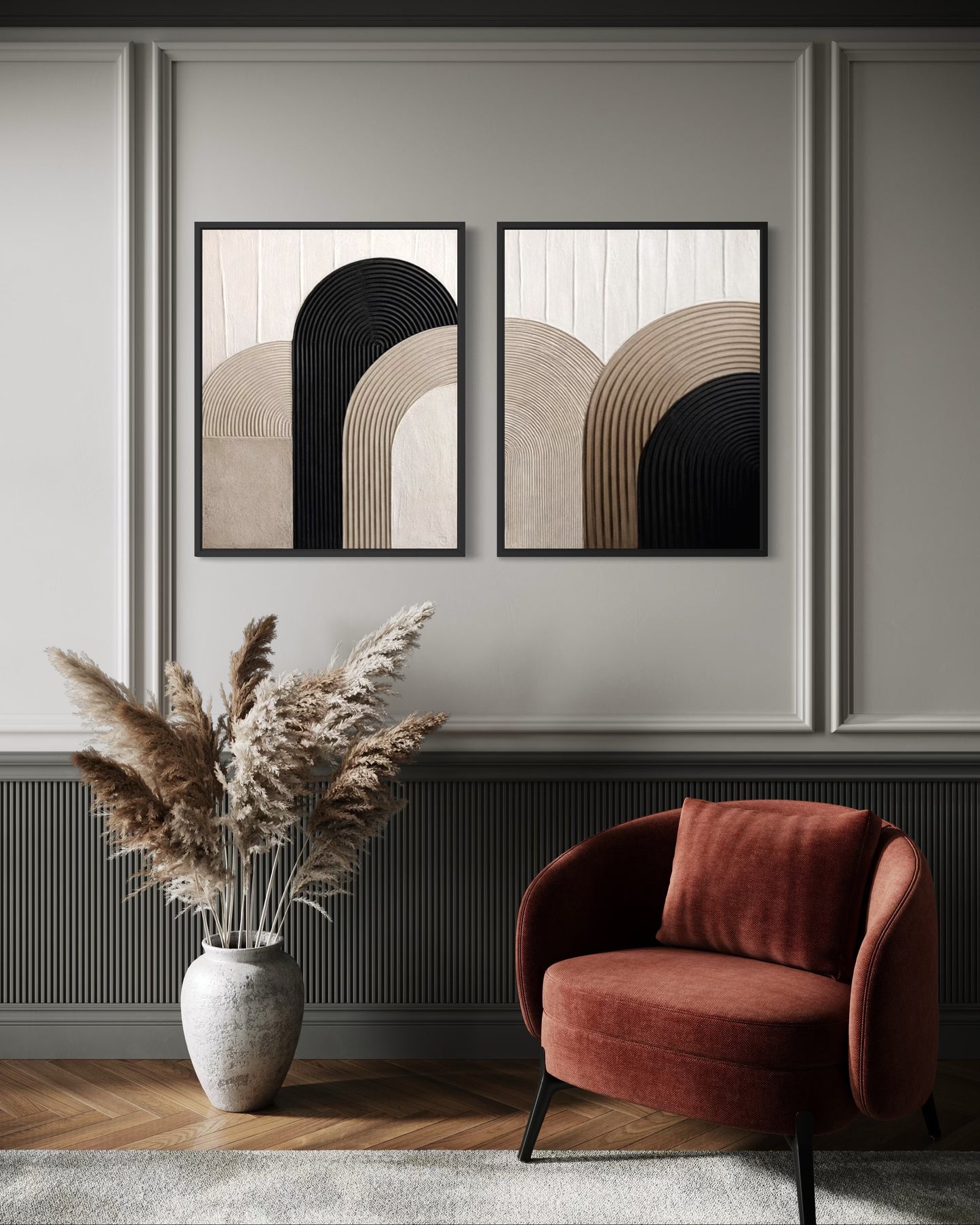 Modern interior with abstract wall art, a vase with dried plants, and a red armchair.